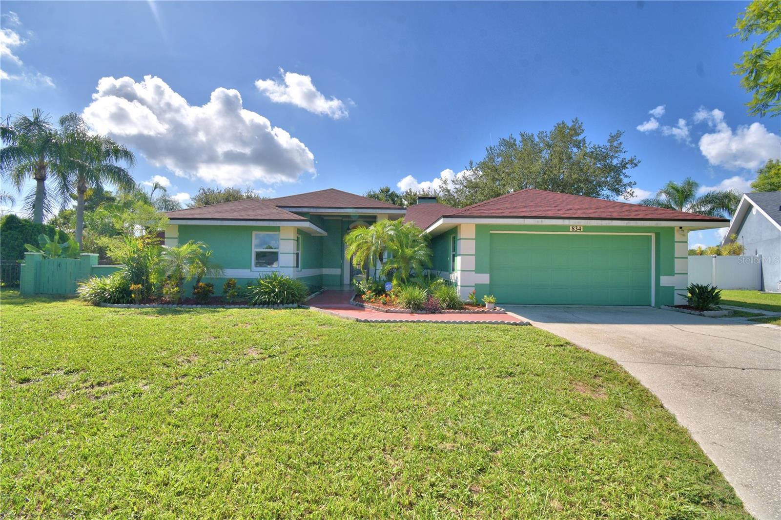 BEATUIFULLY UPDATED AND ON ALMOST HALF AND ACRE...This very well maintained 3 Bedroom/2 Bath home features NO HOA, NEW ROOF 4/26/2024 WITH 25 YEARS WARRANTY. Walk right into the foyer and see the spacious living room new tile flooring and provides a nice open floor plan with a wood burning fireplace. Updated kitchen with Island, Breakfast Bar and Tile Countertops. The primary bedroom has beautiful crown molding and a built-in headboard with its own access door out to the lanai. Primary bathroom has been fully updated and features dual sinks, walk in shower with rain shower feature and tile countertops Both bathrooms have been completely remodeled. Third bedroom is currently being used as an office but could be converted back to a bedroom. Spacious laundry room with built in cabinets and countertop. Walk out your beautiful French Doors to your own backyard oasis a spacious screened in lanai. The large backyard offers enough space to store your outdoor toys and is ideal for contractor or any one that wants space. Two extra large sheds, one is 13x30 insulated, equipped with AC unit and running water, the second shed is 10x20 only two months old. The backyard has a gate entrance from the main road. This home is a must see...Solar panels help keep the electric under $180.00/month. Schedule your private showing today!!
