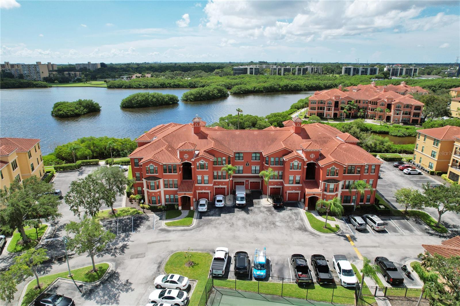 Welcome to your dream living space - a fully furnished, luxurious 2nd-floor condo boasting breathtaking water views. This spacious 3-bedroom, 2-bath unit comes with a massive BALCONY, perfect for unwinding and taking in the serene surroundings. Step inside and be captivated by the well-designed split bedroom floor plan, ensuring privacy and comfort for all residents.As you enter, you'll be greeted by neutral tile flooring that seamlessly flows through the kitchen, living, and dining areas, creating an inviting and elegant atmosphere. The kitchen is a chef's delight, featuring a gas stove, beautiful granite countertops, and a convenient breakfast bar, making meal preparation a true pleasure.Indulge in the luxurious amenities of the Master Bath, complete with dual sinks set in a granite vanity, as well as a relaxing tub/shower combo. The Master bedroom offers the convenience of a large walk-in closet, providing ample space for all your wardrobe needs.Equally impressive, the second bedroom also boasts a large walk-in closet and a private bathroom, making it perfect for guests or family members.Experience the lifestyle you deserve at The Grand Venezia, where amenities abound. Take a dip in the heated pool and spa, play a game of tennis, or let the kids enjoy the playground. The property even includes a convenient car wash area, ensuring your vehicle stays in top condition.For outdoor enthusiasts, a 1.5-mile paved path overlooks the stunning beauty of Tampa Bay, ideal for walking, jogging, or simply soaking in the scenery.Stay fit and active with access to the updated fitness center, open 24/7, ensuring you can exercise on your schedule. Rest easy knowing the attended guard pavilion offers round-the-clock security for your peace of mind.The Grand Venezia has recently undergone a thoughtful renovation project, enhancing the community with a new tile roof, stucco, and hurricane windows, exemplifying its commitment to providing a top-tier living experience. This well-maintained condo is conveniently located near shopping, restaurants, and schools, making it an ideal choice for those seeking both comfort and convenience in their daily lives. Don't miss the opportunity to make this fully furnished oasis your home. Schedule your viewing today and experience the luxurious lifestyle offered by The Grand Venezia.