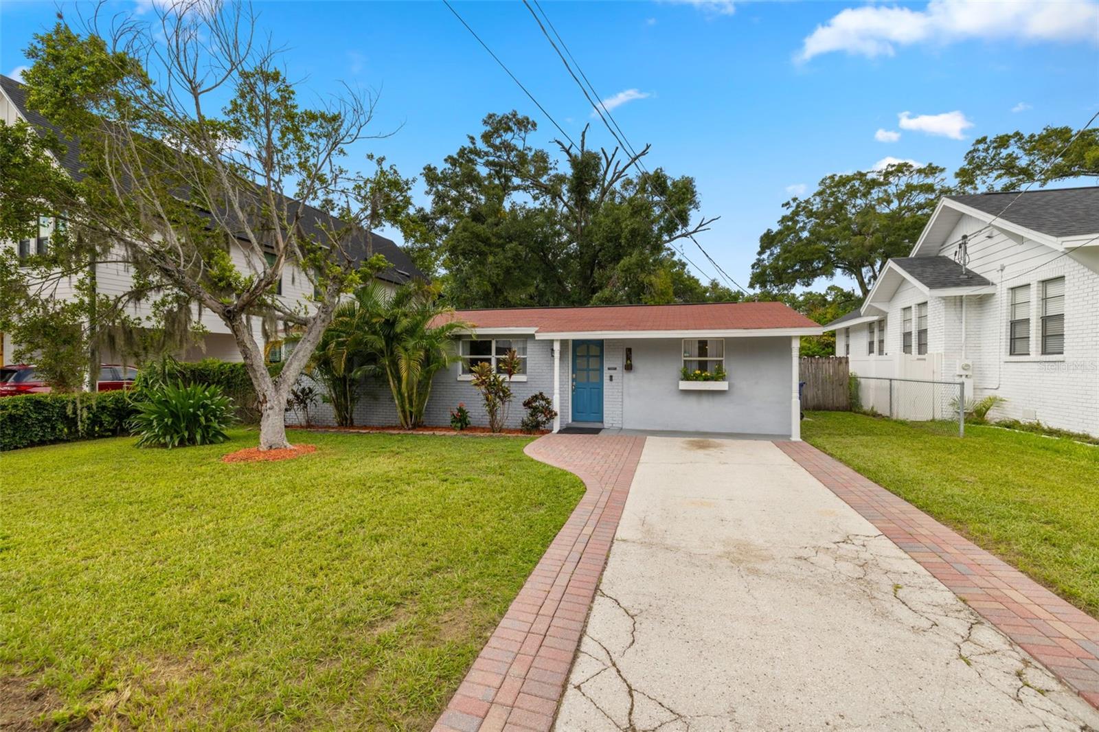Welcome to this beautifully updated 3-bedroom, 1-bathroom home with a backyard that’s ready to steal the show. Whether you’re entertaining friends or unwinding after work, this vibrant oasis is impossible to replicate. A custom-built, air-conditioned “pub shed” is the ultimate hangout spot for celebrations both big and small. The totally unique bar opens right up to a large deck and fenced-in yard—perfect for hosting, relaxing, or watching the kids (or dogs) run around. There’s even an additional storage shed for all your extras.
Inside, the spacious, modern kitchen provides plenty of room for cooking and gathering, while the updated bathroom and indoor laundry room add everyday comfort and convenience. All three bedrooms are generously sized, with the option to remove custom shelving in the second bedroom to suit your needs. With new appliances, a new roof from late 2019, and new air conditioning, the only thing missing is someone to make it their own.
Located in a vibrant, walkable pocket of Seminole Heights, this home is just minutes from local favorites like Mekenita Cantina, Gulf Coast Sourdough, and Wicked Oak BBQ. And when you need a dose of nature, Epps Park and the Hillsborough River are just a short walk through the quiet neighborhood—perfect for morning strolls, picnics, or catching a glimpse of dolphins and manatees during the holiday boat parade.
Whether you're hosting in the backyard or exploring the coolest neighborhood in Tampa (just 10 minutes from downtown), this one-of-a-kind home offers the perfect mix of charm, modern updates, and laid-back lifestyle.