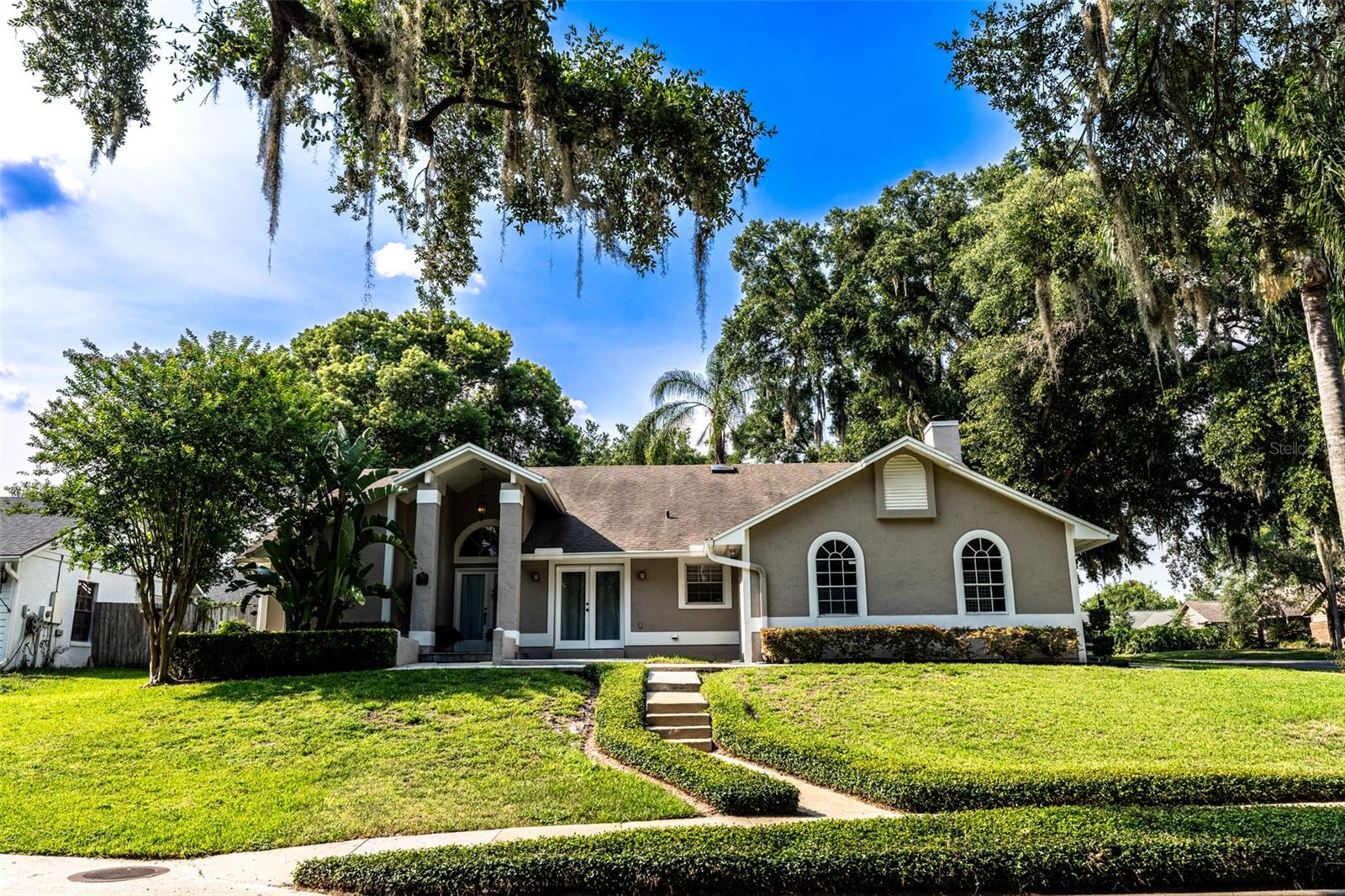 Welcome to this stunning pool home with extraordinary architecture, tucked among the mature oaks of Altamonte Springs. This unique 4-bedroom, 2-bath residence includes a private-entry in-law suite, offering great flexibility for extended family, guests, or rental income.
Located in the quiet cul-de-sac community of Altamonte Oaks, this home offers plenty of space for comfortable living and entertaining.
Inside, you’ll find quality flooring throughout and well-proportioned living areas that adapt to your lifestyle. Enjoy peaceful mornings on your elevated front porch overlooking the beautiful greenspace and mature oaks right across the street.
Step out back to your private pool oasis, perfect for relaxing or hosting friends and family.
This home is ideally located just one mile from Crane’s Roost Park, the Altamonte Mall, and dozens of popular restaurants, shops, and entertainment options.
Don’t miss your chance to own this special home in a sought-after location with low traffic and plenty of character.