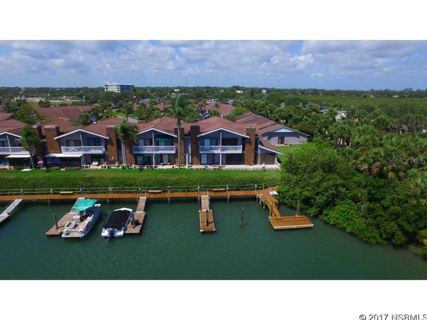 Outstanding waterfront townhome with its own DOCK right outside your back door! Central location puts you within walking distance of all that Canal Street has to offer, as well as eclectic Flagler Avenue's beachside restaurants, pubs, shops and boutiques. Living area and master suite overlook tranquil lagoon with Intracoastal Waterway access for your boat. Vaulted ceiling, fireplace, built-in wine rack, 1/2 bath on ground floor and spacious 1-car garage with electric roll-down screen are but a few features of this comfortable waterfront home. Open floor plan and updated kitchen with newer cabinets. Loft area is perfect for your home office or quiet seating area. Master suite features spacious en suite bath with twin sinks, and east orientation provides you with glorious sunrises to enjoy from the master's own private balcony or from your bed!  Master balcony and ground floor patio have retractable canopies, ground floor is electric.  New on the market, don't miss out on this affordable and unique opportunity to acquire this waterfront townhome that is ready for you to start enjoying the Florida lifestyle! ;Water: City