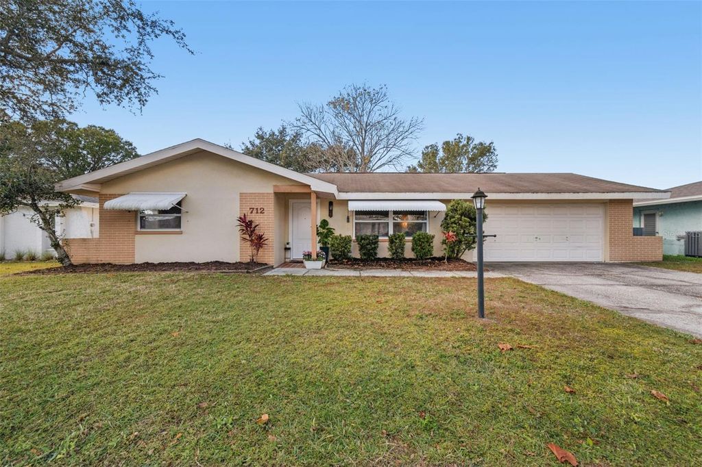 Photo of 712 Lemonwood Dr, Oldsmar, FL 34677 (MLS # TB8459392)