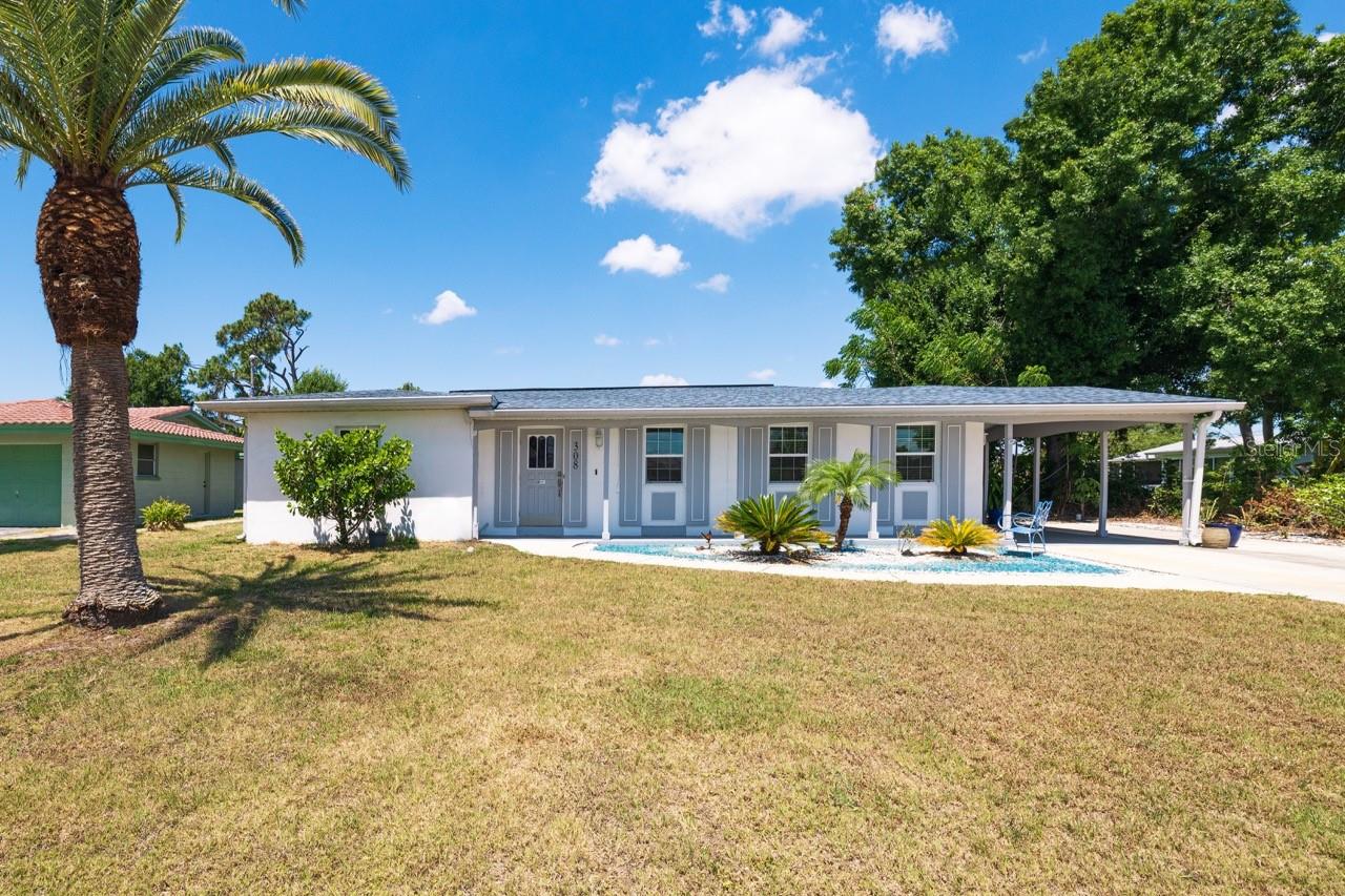 One or more photo(s) has been virtually staged. WATERFRONT 3 Bedroom, 2 Bathroom, 1-Car Carport home with a Florida room is situated on an OVERSIZED LOT & SALTWATER CANAL in Port Charlotte. NO HOA FEES! CLICK ON THE VIRTUAL TOUR LINK 1 FOR THE VIDEO AND VIRTUAL LINK 2 FOR THE 3D TOUR. Interior features include tile flooring throughout, French doors to the Florida room and 1,000+ square feet of living space! Enjoy quality time with friends and family in an open living and dining room. The kitchen has all appliances, plenty of cabinets for storage, a breakfast bar, a skylight, a service window to the family room, and an off-kitchen dining room. The primary bedroom & a guest bedroom are both only a few steps away from a shared bathroom, which is complete with a shower/tub combo, and a pedestal sink. Beyond the dining room is the third guest bedroom with a built-in closet. Expand your living and entertaining space to a spacious family room with plenty of windows for natural lighting, along with the laundry room and second bathroom. A large backyard can be your oasis with three storage sheds and a private wood dock, perfect for fishing or setting off on a water adventure. Minutes to the Edgewater Public boat ramp, the William R Gains Recreation Park, and close to US-41 & Port Charlotte Beach Park. Port Charlotte Beach Park offers sand, sheltered waters, and spectacular sunsets year-round. Amenities include a boardwalk with a fishing pier, boat ramp, canoe/kayak launch, horseshoe pits, bocce courts, basketball courts, tennis courts, volleyball court, playground area, small shelters with picnic tables, two large pavilions, restrooms, heated swimming pool, and a recreation center. Also just a short car ride to the Gulf Beaches of Boca Grande, Englewood, or Manasota Key to name a few where you will find world-class fishing and sand between your toes. Schedule your showing TODAY!