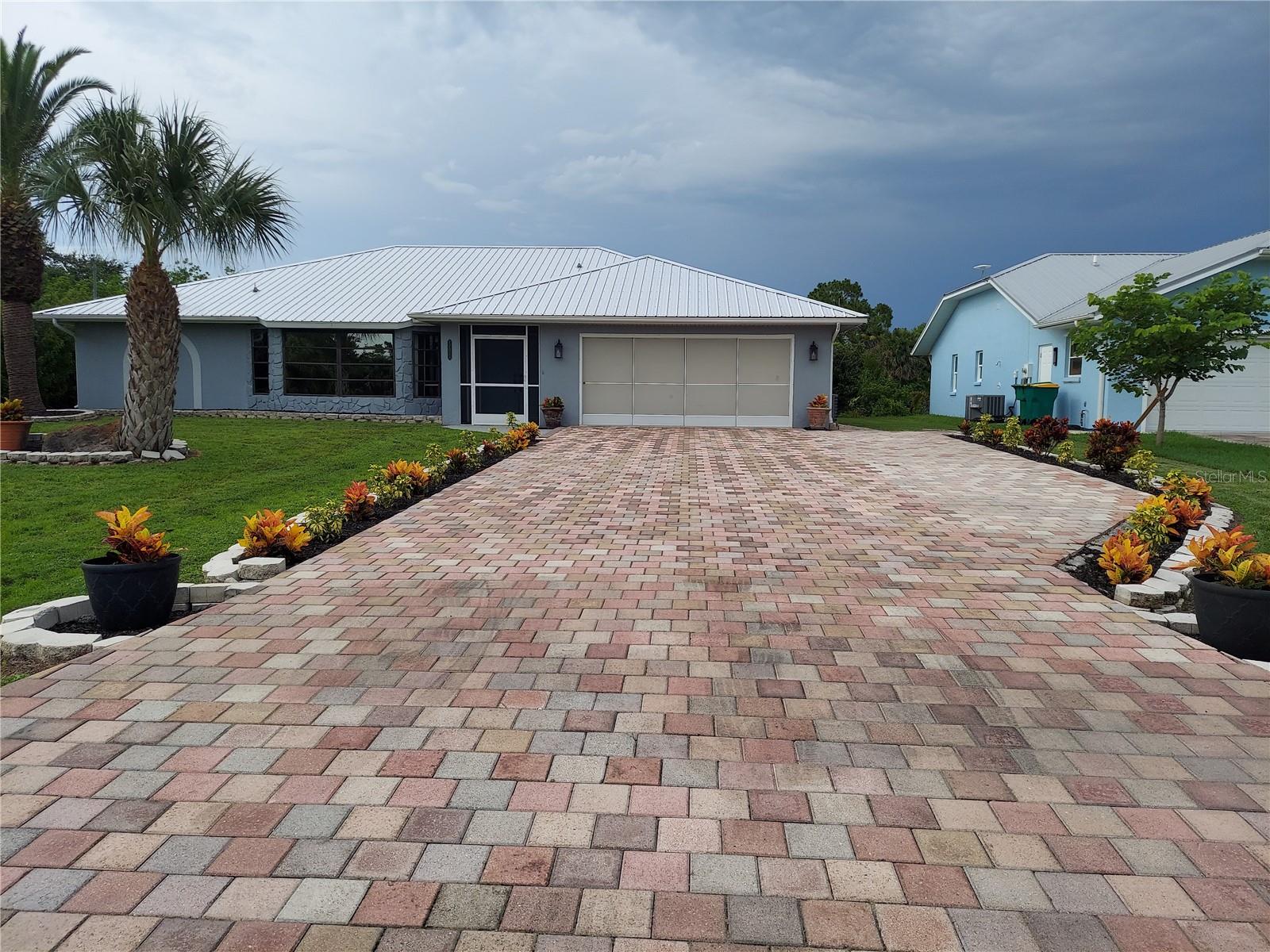 Coming to Florida? Deciding whether to rent or buy? This is for you! "Bring your boat and your bathing suit!" Everything else is here for you in this sprawling 2,300 Sq Ft 3-BR 2 Bath "Sailboat" Waterfront Home...Located on a beautiful wide canal near the Preserve, that goes directly out to Charlotte Harbor and the Gulf with no bridges! This incredible spacious home offers high ceilings, open floor plan, incredible views, lovely private landscaping, new kitchen, new appliances & fixtures, huge paver driveway with wing for your RV or boat, Huge screened 2-car garage, patio & pool deck, sparkling heated inground pool, huge dock for your boat & more! New HVAC, hot water heater & over $40K worth of brand-new metal roof! (Far superior to asphalt shingle!) So, look no further. Your "dream home in paradise" awaits you! Rent this amazing property or buy! Rental is a 2-year lease to very qualified renters only! Full credit & income required. $4600/Month includes pool service & landscaping! A $500 savings! Also, the lease will include a "first right of refusal" to purchase.