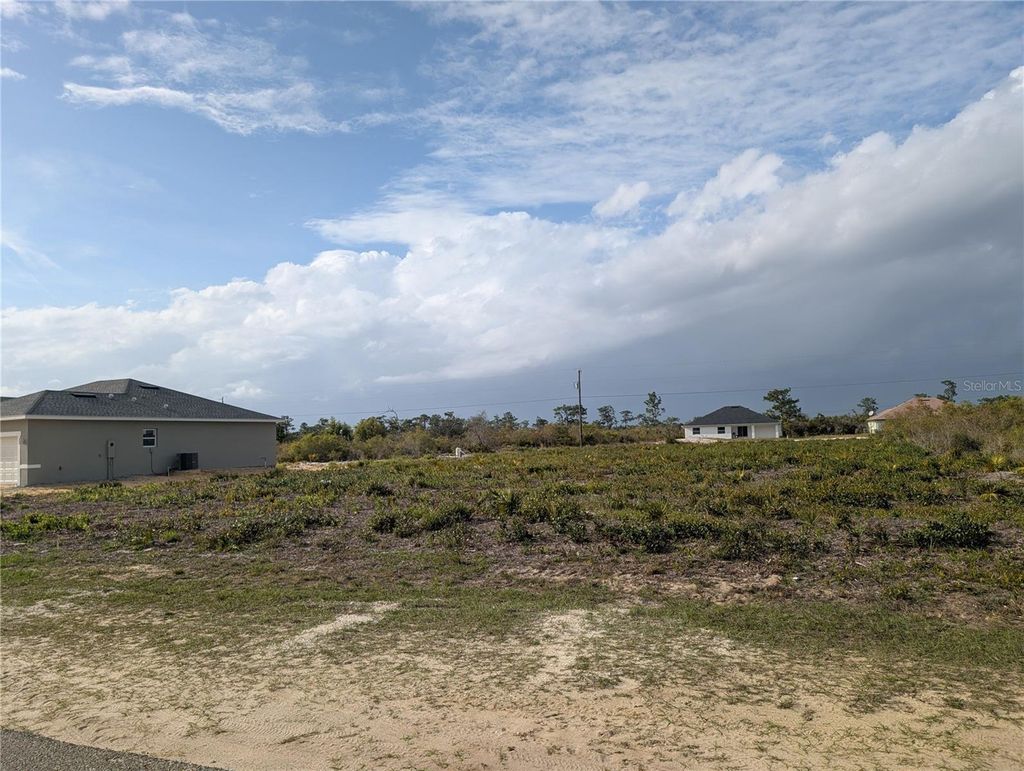 Photo of 12 Poinciana Drive, Indian Lake Estates, FL 33855 (MLS # P4938273)