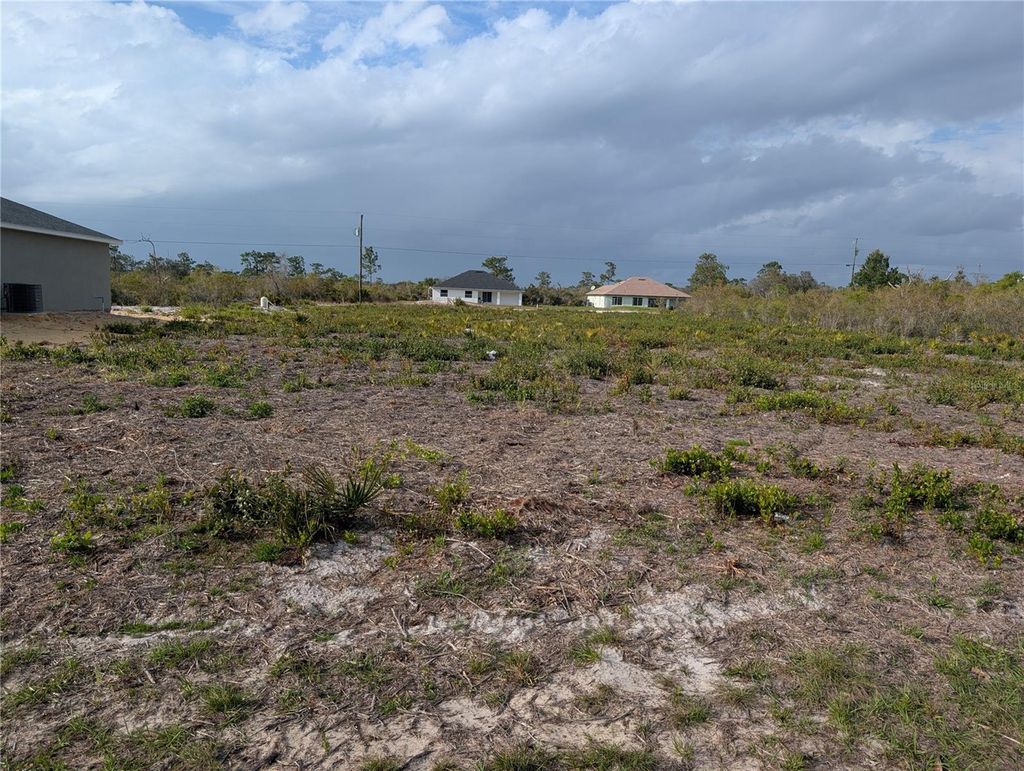 Photo of 12 Poinciana Drive, Indian Lake Estates, FL 33855 (MLS # P4938273)