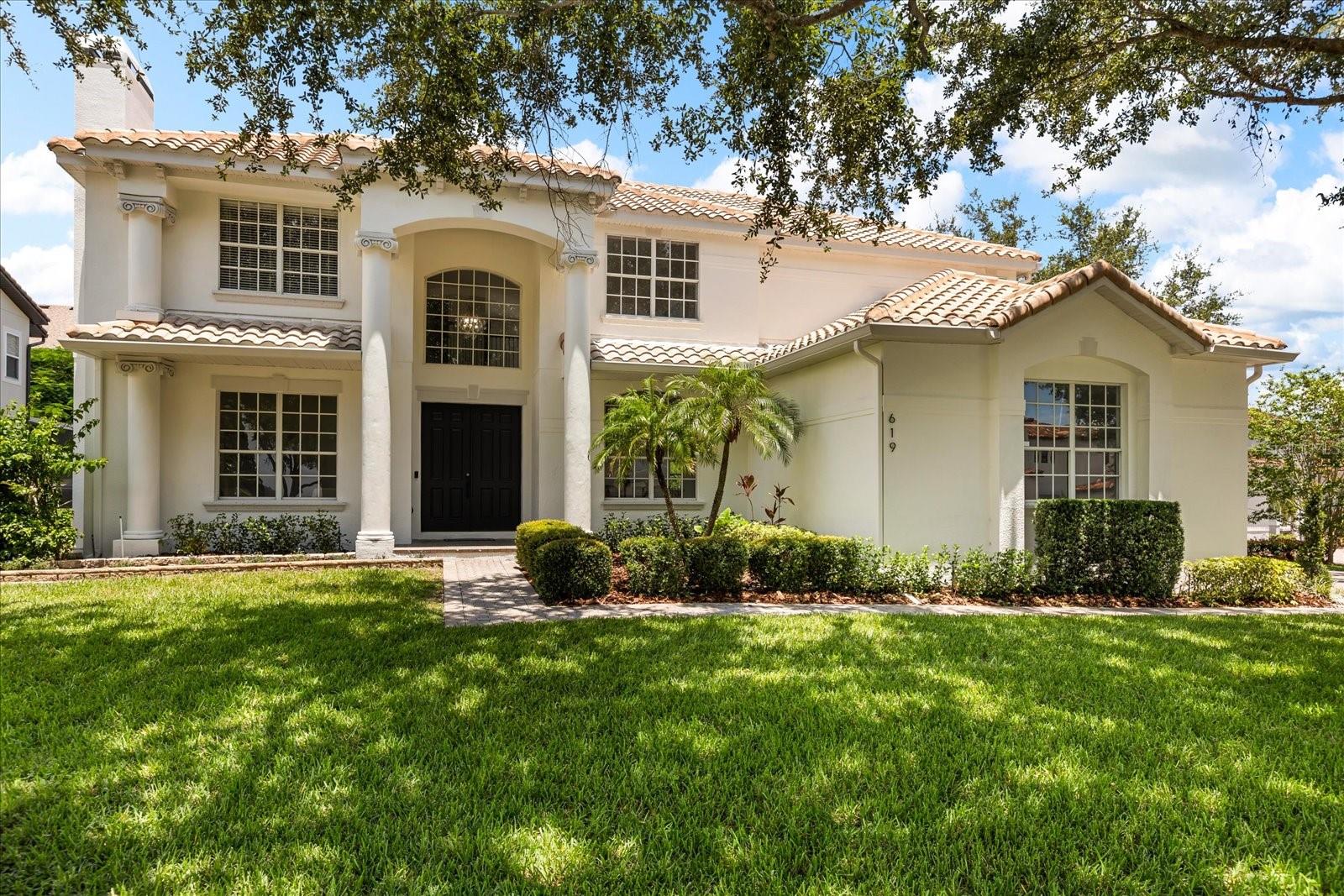 Welcome to 619 Largovista Dr—a custom-built, recently remodeled home in the highly desirable, gated community of Johns Landing on Johns Lake. This one-of-a-kind property features luxury finishes and a beautifully designed layout, along with mature fruit trees for a touch of natural charm. Step into the grand foyer and take in the stunning light fixtures cascading from the soaring ceilings. To your left, a cozy wood-burning fireplace offers the perfect spot for relaxing nights in. To your right, the spacious dining room is enhanced with elegant wainscoting that extends from floor to ceiling.The living room features an inviting entertainment area with sliding glass doors that flood the space with natural light and provide easy access to the backyard. The kitchen is a showstopper, equipped with sleek white slim shaker cabinets and a striking white oak range hood. Just outside, your enclosed outdoor kitchen makes entertaining a breeze.Step into your own tropical paradise and enjoy fresh peaches, mangos, Barbados cherries, and June plums from mature fruit trees. Back inside, retreat to the primary suite, where an exquisitely designed bathroom awaits—complete with a marble walk-in shower for two, a soaking tub, and a 96-inch dual vanity.Upstairs, you'll find a large loft, four spacious bedrooms, and two additional bathrooms. From the loft, step out onto a balcony overlooking the yard—perfect for your morning coffee.Johns Lake offers endless opportunities for fishing,
boating, jet skiing, paddleboarding, water skiing, and wakeboarding, with private access from the community boat ramp just down the road. The location is ideal—just off the Turnpike and Highway 50, with biking access to the Orange Trail and the historic Downtown Winter Garden, known for its charming restaurants and boutique shops. Only 25 minutes to Downtown Orlando, Disney, major attractions, and Orlando International Airport.