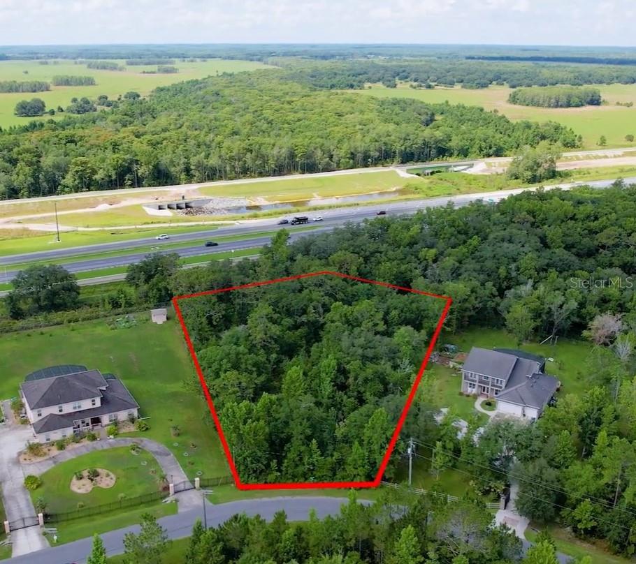 Discover the perfect opportunity to build your dream home in this highly sought after golf and equestrian community. 1.39 acres with ample dry land in the back, providing an ideal setting for your home while ensuring privacy.  Backing up to protected conservation land and the highway, you'll enjoy a serene and secluded atmosphere with no rear neighbors. Nestled in a peaceful, well-maintained neighborhood with easy access to major roadways, this lot offers a perfect blend of convenience and tranquility.  Whether you're envisioning a custom estate or an investment opportunity, this property provides the space and setting you need.  Don't miss out on owning a piece of Wedgefield's sought-after landscape!  Buyers responsible for due diligence.