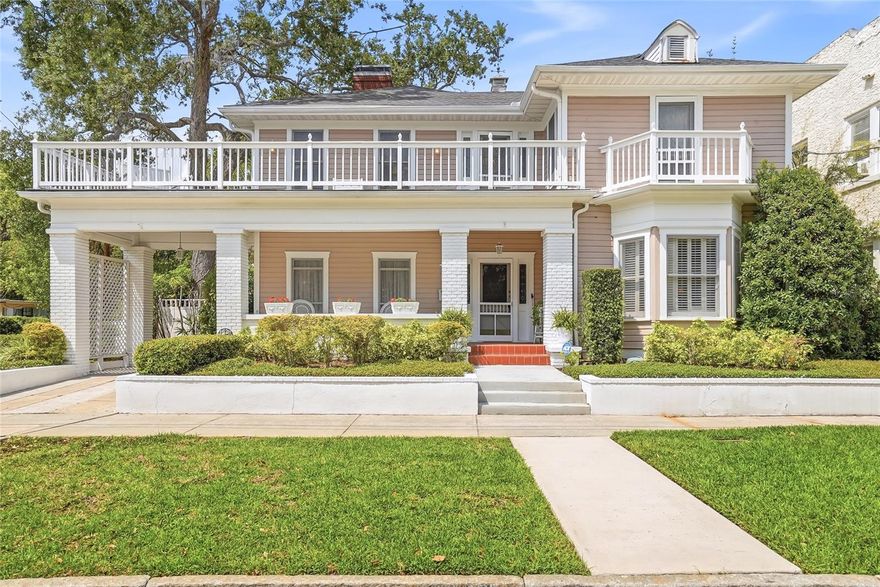 Moments from iconic Bayshore Boulevard and Hyde Park Village, this classic 1920s residence sits along one of Hyde Park’s charming tree-lined streets near the vibrant SoHo district. A welcoming covered front porch introduces a home rich with character, including refinished hardwood floors, substantial millwork, leaded and stained glass windows, and four wood-burning fireplaces. Sunlit living and dining rooms feature high ceilings and elegant proportions, while the kitchen and adjoining gathering spaces provide an inviting setting for everyday living and entertaining with a Thermador gas range, built-in oven, wine fridge, Bosch dishwasher and fridge, and bar seating. A flexible first-floor room works well as an office, den, or guest bedroom. A wraparound porch overlooks a landscaped backyard with brick pavers and space for outdoor gatherings. Upstairs, the primary suite features a fireplace, custom walk-in closet, and a bright bathroom with dual vanities, soaking tub, and walk-in shower, completing this timeless Hyde Park home.