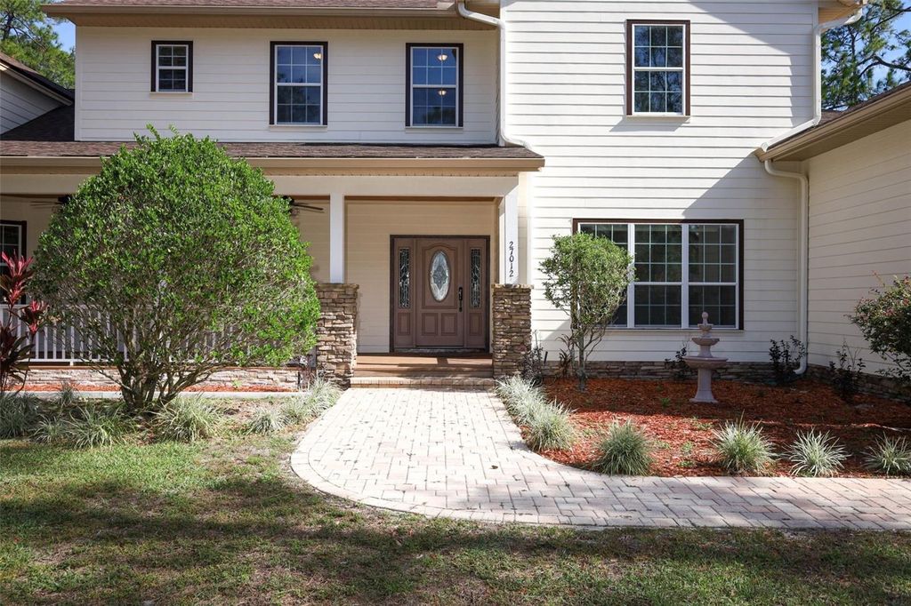 Photo of 27012 Grand Oak Lane, Tavares, FL 32778 (MLS # O6360186)