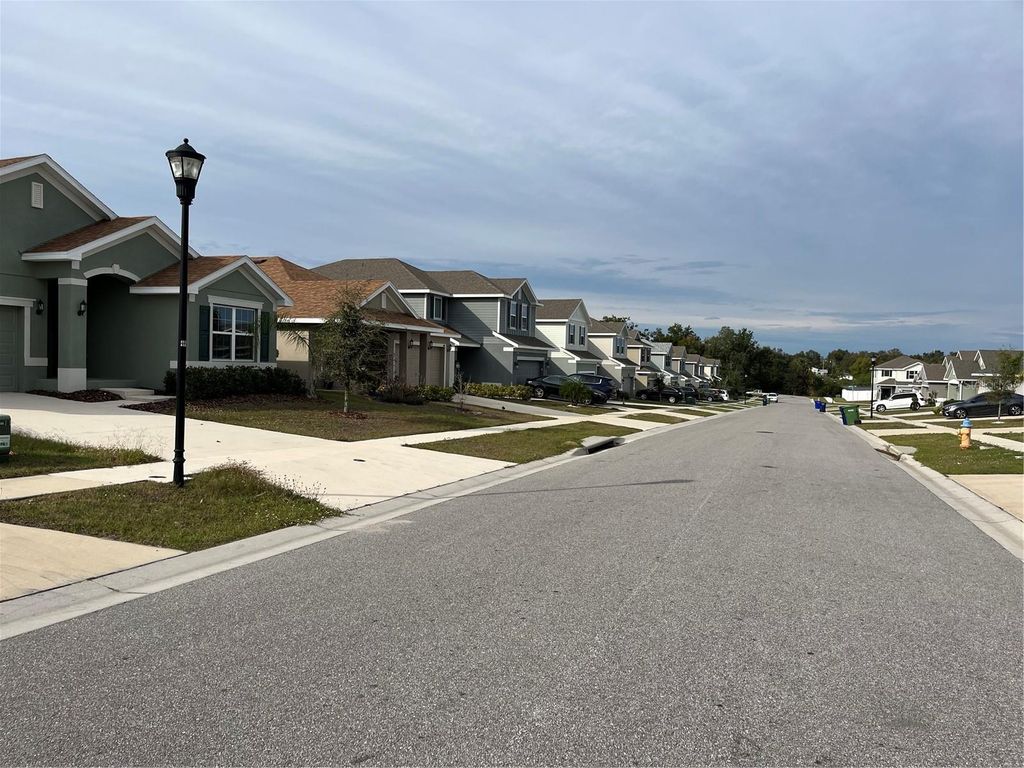 Photo of 136 Krenson Bay Loop, Winter Haven, FL 33881 (MLS # O6374266)