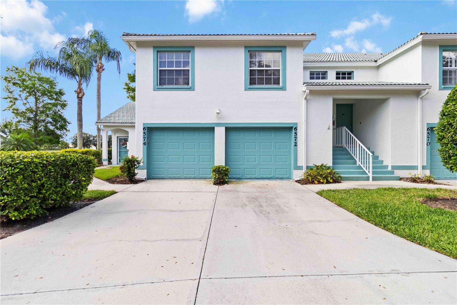 Welcome to your piece of paradise in one of Bradenton’s most coveted golf course communities! This spacious and light-filled 2-bedroom, 2-bath condo offers the perfect blend of resort-style living and everyday comfort — all with panoramic views of the lush fairways and a peaceful pond that brings nature right to your doorstep.The kitchen is equipped with Corian counters and ample workspace, including a desk area. The primary bedroom also features vaulted ceilings, direct lanai access, and lake/golf course views, complemented by a walk-in closet and a primary bath with a walk-in shower and double vanity. A notable flexible feature is the second bedroom, which includes a built-in Murphy bed and a desk area, allowing it to function as both a guest room and a home office. The property also benefits from a one-car attached garage on the ground level, accessible from the interior. As part of the Tara Golf & Country Club, the condo includes a Class A membership, providing access to a wide array of amenities. These include an 18-hole championship golf course, tennis courts, pickleball courts, a state-of-the-art fitness Center, and a resort-style pool. Conveniently located to shopping, dining, and easy access to I-75. Schedule your showing today!