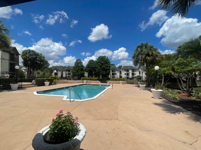 Photo of 1964 Lake Atriums Circle #154, Orlando, FL 32839 (MLS # TB8544487)