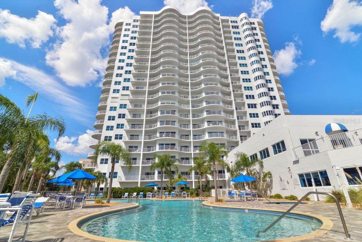 AN ARCHITECTURAL MASTERPIECE! NOTHING SHORT OF SPECTACULAR! LOCATED IN THE EPICENTER OF DAYTONA BEACH SHORES, A SCENIC COASTAL CITY ALONG THE ATLANTIC OCEAN. THIS COASTAL GEM IS UPGRADED WITH ALL THE SHIFTING BUYER PREFERENCES! EVERYTHING INSIDE THE DOUBLE-DOOR ENTRY IS LUXURIOUS! THE OVER-SIZED TILE FLOORING, THE LAYERED LIGHTING, THE PRIVATE PRIMARY SUITE, THE 3 SEPARATE BALCONIES THAT SHOWCASE SUNRISE AND SUNSET VIEWS FOR OPTIMAL PLEASURE AND BOTH OCEAN AND RIVER VIEWS! THE TIMELESS APPEAL OF A BLUE AND WHITE KITCHEN THAT WAS THE INSPIRATION FOR A SERENE, COASTAL VIBE. THE CABINETS ARE THE BACKBONE OF THIS DREAM KITCHEN. QUARTZ COUNTERS AND LARGE POLISHED PORCELAIN FLOORING COMBINE FOR A CLEAN, COHESIVE LOOK WITH CHARM. FORM FOLLOWS FUNCTION IN THIS ISLAND KITCHEN WITH AN ADJACENT OFFICE AND CURVED GLASS WINDOWS THAT LOOK LIKE A SCULPTURE. THE BAR GRACEFULLY CONNECTS TO THE DINING SPACE WITH CUSTOM BRUSHED GOLD LIGHTING. ENTER THE GUEST WING THROUGH THE GALLERY FOYER THAT IS
ULTIMATELY PRIVATE AND BOTH BEDROOMS LEAVE NOTHING TO BE DESIRED, EACH WITH THEIR OWN FULL BATH AND DIRECT RIVER VIEWS.
THIS CONDOMINIUM ESTATE OFFERS A CHIC STYLE WITH AN UNPARALLELED LIFESTYLE SURROUNDED BY WALLS OF GLASS IN A COASTAL CITY.
5 STAR AMENITIES INCLUDE A PALATIAL SWIMMING POOL & SPA, A LOUNGING DECK SURROUNDED BY PALM TREES, THE POOL SIDE GYM AND SAUNAS, WITH EASY INDOOR/OUTDOOR ACCESS.
WITHIN WALKING DISTANCE TO THE COMMUNITY CENTER, A THRIVING CITY CENTRE WHERE RESIDENTS MEET FOR CLASSES, CONCERTS AND CELEBRATIONS. WALKING DISTANCE TO GOLF & RACQUET CLUBS, GROCERY SHOPPING AND BANKING.
YOU CAN HAVE IT ALL! THIS EXCEPTIONAL LOCATION OFFERS ABSOLUTELY EVERYTHING AT YOUR FINGERTIPS ALONG THE BEACH!