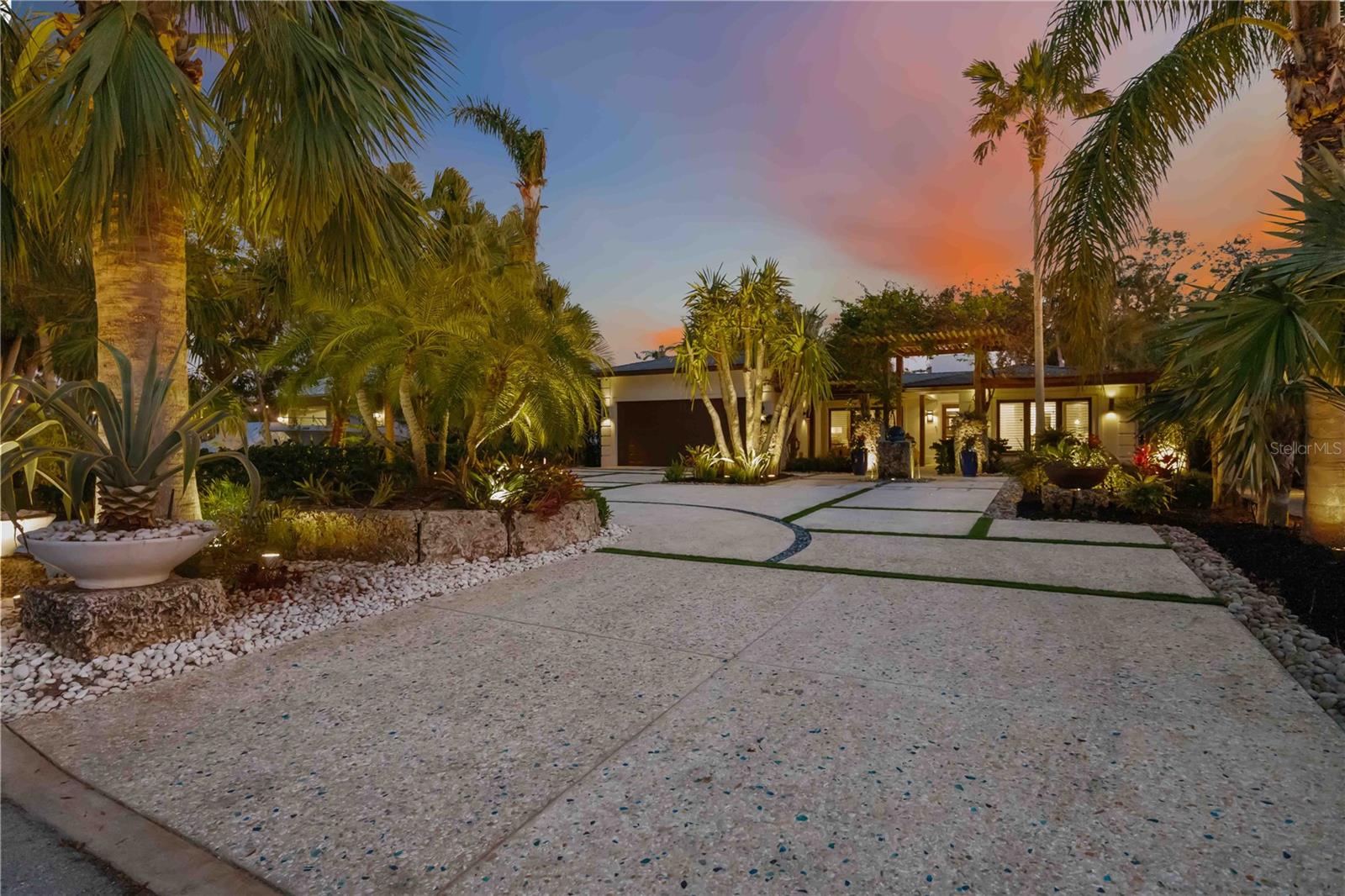 **Under Contract ~ Accepting Backup Offers** Escape to paradise in this custom-built Balinese-style home nestled in the coveted Sapphire Shores neighborhood. This exquisite residence boasts 3 bedrooms, 2.5 baths, and over 2,240 sq.ft. of living space designed for both relaxation and grand entertaining. An enchanting courtyard, adorned with a soothing water fountain and lush landscaping, welcomes you home. Indulge in culinary delights in the chef's kitchen, featuring a custom wine cooler, spacious pantry, top-of-the-line Sub-Zero/Wolf appliances, and elegant composite countertops. Throughout the home, you'll find exquisite finishes, including travertine, coral, and other natural elements that enhance the home's unique character. The split-bedroom layout provides privacy and ample space for guests, making it perfect for both vacations and everyday living. Immerse yourself in the awe-inspiring outdoor living space, complete with a sparkling Pebble-Tec pool and spa, tropical landscaping, and a gourmet outdoor kitchen featuring a 56" Alfresco grill, beverage station, and bar. Relax under the 35' Cypress Balinese Pavilion, complete with a cozy gas fireplace, or gather around the gas fire pit and tiki torches for enchanting evenings under the stars. Enjoy easy access to Sarasota Bay via the neighborhood boat launch and explore nearby attractions like Sapphire Shores Sunset Park and the renowned Ringling Museum. Don't miss this opportunity to own a truly exceptional property, call the listing agent today to schedule your own VIP tour and receive a copy of the property feature sheet which includes Room By Room Highlights, Items Of Interest, and FAQ's!