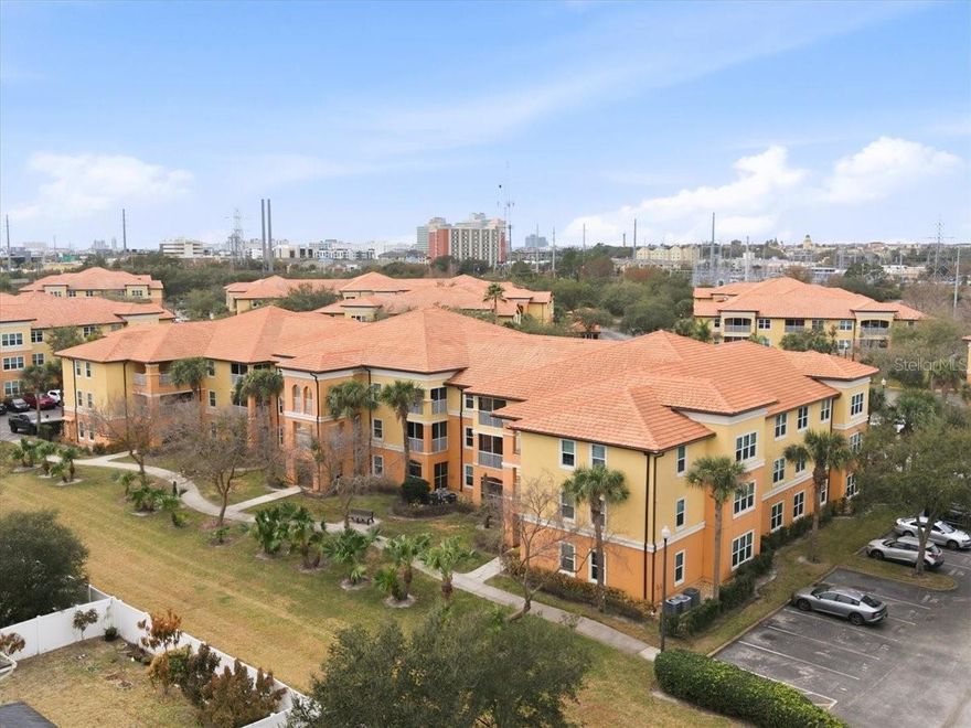 Move-in ready first-floor 1 bedroom, 1 bathroom condo located in the Millenia area within the gated Cypress Fairway community. This unit offers an open layout with a solarium providing additional usable square footage and a large window for natural light. Interior features include ceramic tile flooring throughout with no carpet, neutral interior paint, and upgraded ceiling fans in all rooms. The kitchen opens to the living area and includes cabinets with hardware, all appliances including a newer microwave, closet pantry, breakfast bar, and adjacent dining space. The primary bedroom is located off the living room and includes an en-suite bathroom with an adult-height single-sink vanity and tub/shower combination. An interior laundry closet includes a full-sized washer and dryer. Community updates include exterior stucco replacement, fresh exterior paint, new energy-efficient windows, added exterior wall insulation, and a roof replacement completed in 2022 by the association. Additional interior updates include new mini blinds and upgraded shower fixtures. One assigned parking space conveys, along with ample guest parking. Cypress Fairway amenities include a recreation center, fitness room, swimming pool, tennis courts, walking trail, picnic areas with grills, and controlled access entry. Conveniently located near I-4, Mall at Millenia, major highways, and area theme parks, offering flexibility for primary residence or rental use.