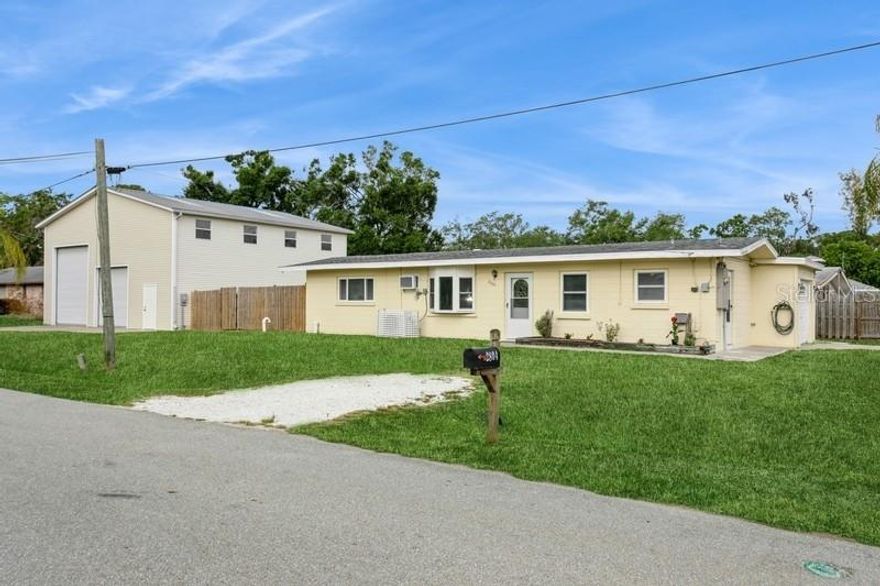 You will not find another one like it!  This property offers the perfect blend of comfortable living and incredible storage.  Massive 36' x 40' outbuilding with oversized doors is perfect for your boat, RV, and more!  Imagine the possibilities!  This charming home features 2 bedrooms, 1 bathroom, a bonus room, a large kitchen and attached garage. The yard with cover patio is perfect for entertaining or to relax and unwind.  Enjoy a bike ride, walk or run on the Legacy Trail (1 block away) and just 8 miles to the world-famous Siesta Key beach!  Don't miss this rare opportunity!