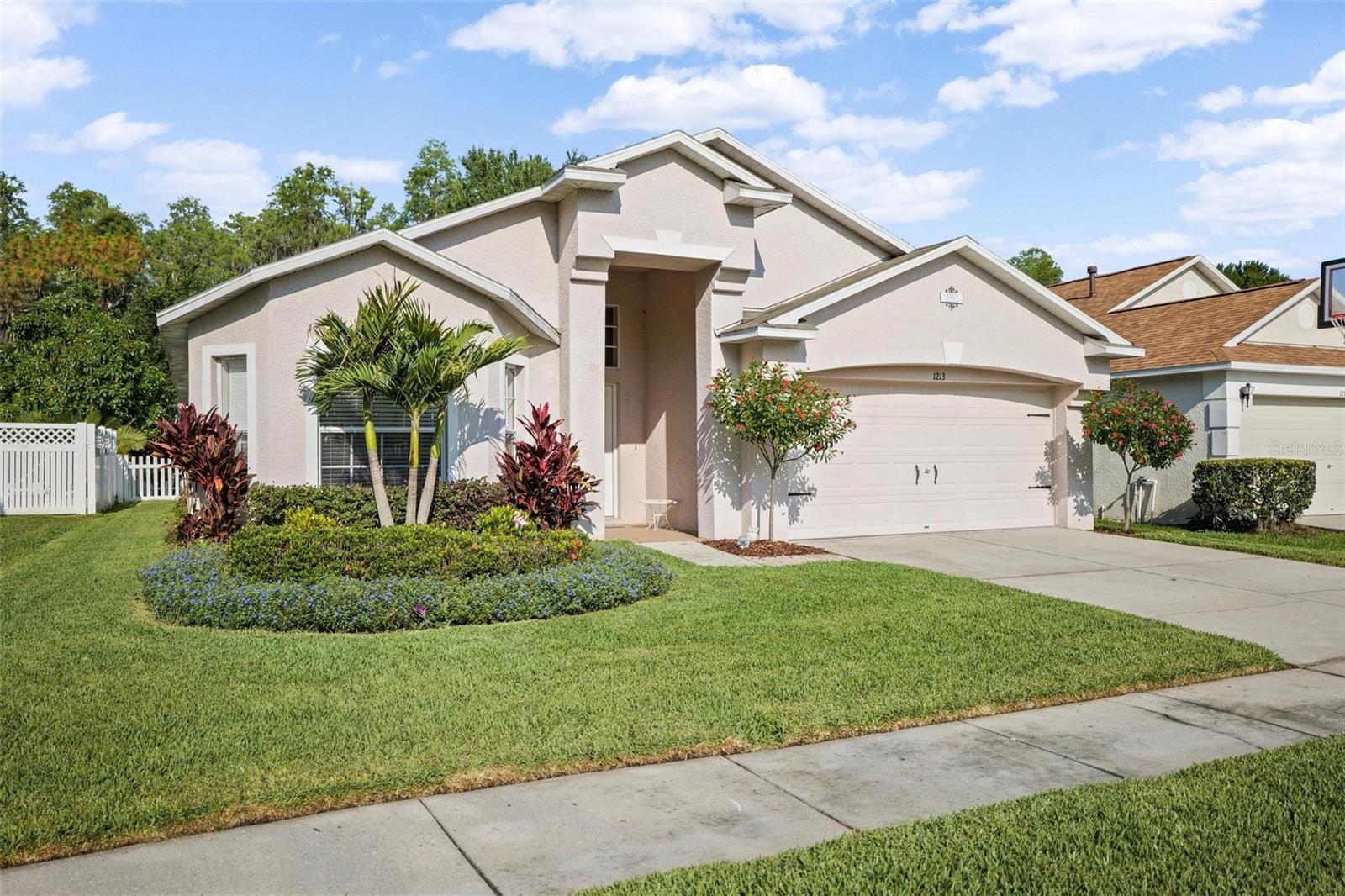 NEW PRICE- NEW ROOF- just installed last week!!, NEW AC in 2021, all NEW interior paint and NEW luxury vinyl flooring in the main living areas. This stunning 4-bedroom, 3-bathroom house is nestled in a quiet CUL-DE-SAC within a vibrant family community. Boasting ample space and functionality, this home is designed to meet all your family's needs and create lasting memories. As you step inside, you'll be greeted by an inviting foyer that leads into the spacious and bright living area. The open floor plan seamlessly connects the living room, dining area, and kitchen, providing an ideal space for family gatherings and entertaining guests. The master suite is a true oasis, complete with a walk-in closet and a luxurious en-suite bathroom, featuring a soaking tub, a separate shower, and dual vanities. The remaining bedrooms are generously sized, perfect for any age, guests, or transforming into a hobby room or home gym. Outside, the backyard is an extension of your living space, offering a private oasis for outdoor activities and gatherings. Whether you're hosting a barbecue, playing with pets or hanging out with the family, or simply enjoying a quiet evening under the stars, the backyard provides the perfect backdrop. The family-friendly community surrounding this home offers a range of amenities, including parks, playgrounds, community pool and walking trails, ensuring that every member of your family has something to enjoy. The cul-de-sac location provides added safety and tranquility, creating a peaceful environment for your family to thrive. New Screened-in lanai and new fence complete this must-see property! Conveniently located near schools, shopping centers, and major transportation routes, this house provides easy access to everything your family needs. Don't miss out on this incredible opportunity to make this house your forever home. Schedule a showing today and experience the magic of this wonderful family community!