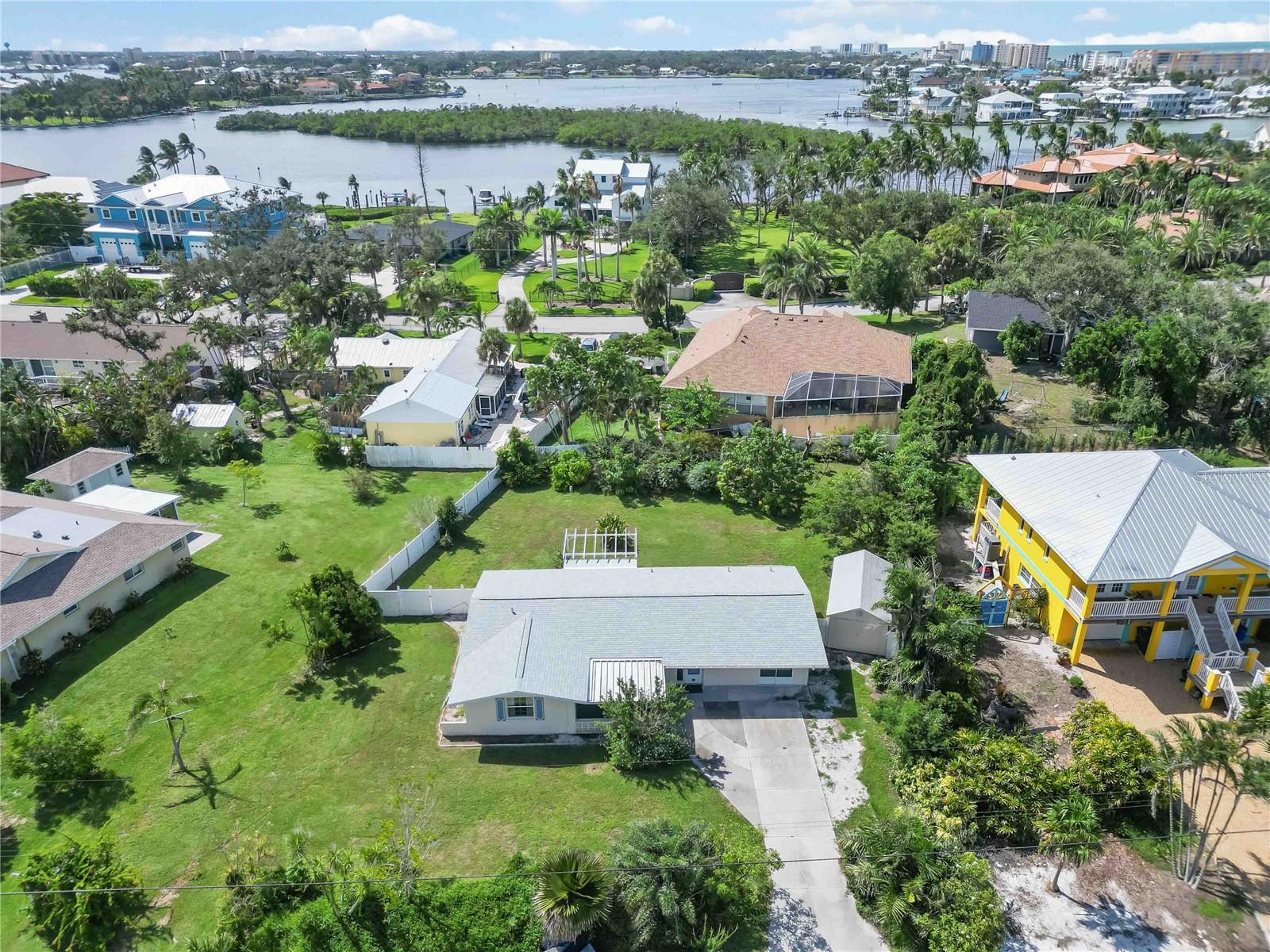 Welcome to the Highly Desireable Bay Point community! Discover the perfect blend of Old Florida charm and unbeatable location in this 2-bedroom, 2-bathroom home with a flex room/optional 3rd bedroom—and best of all, this property has never flooded!
Highlights: Just 0.3 miles to beach access with kayak & paddleboard launch; Original terrazzo floors and both front & back screened porches;
Oversized lot with plenty or room for a pool and endless possibilities—renovate the existing home or build your Florida dream home. Mature landscaping including a bountiful mango tree, fenced yard, and large shed with electricity. New roof (2022), AC (2017), new septic tank and drain fields (2011) and newer windows and sliders.
Enjoy the laid-back coastal lifestyle with beach access at Lyons Bay Park (0.3 miles), Bay Point Park (0.5 miles), Nokomis Beach (1.5 miles), North Jetty Park (2.2 miles), Venice Beach (3.4 miles), and Downtown Venice just minutes away, plus easy access to I-75 for quick travel. Don’t miss out on this affordable opportunity to own in Bay Point—one of Nokomis’ most desirable beachside communities!