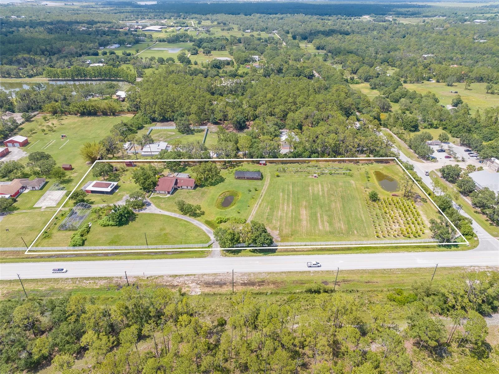 ZONED AGRICULTURAL. Welcome to this remarkable 5-acre property nestled amidst a picturesque landscape of beautiful trees and tranquility. Located in the peaceful countryside of Sarasota, this expansive parcel of land offers an exceptional opportunity for those seeking a private retreat with endless possibilities. The property is zoned agricultural, providing the flexibility to cultivate your own vision and fulfill your dreams. At the heart of this property lies a unique opportunity—a house that awaits your personal touch. This "handyman special" presents an exciting canvas for creative renovation and customization. With your vision and craftsmanship, transform this home into a charming haven that reflects your unique style and preferences. Beyond the house, this property offers plenty of room for expansion and possibilities limited only by your aspirations. Whether you envision constructing additional structures, such as a guest house, barn, or workshop, or creating outdoor recreational areas, the vast acreage ensures that your dreams can become a reality. Unleash your creativity and capitalize on the abundant space available to bring your vision to life. The sprawling grounds provide a haven for nature enthusiasts and outdoor enthusiasts alike. The property offers plenty of room to bring your toys, whether it's RVs, boats, or off-road vehicles. Embrace a lifestyle of leisure and exploration as you make the most of your vast private oasis. Located in a desirable area of Sarasota, this property provides a peaceful retreat away from the hustle and bustle of city life while still offering convenient access to Waterside at Lakewood Ranch, UTC mall, downtown Sarasota, world renowned beaches and much more. Embrace the freedom of rural living while enjoying the conveniences of modern amenities just a short distance away. Don't miss this rare opportunity to own 5 acres of scenic land with the potential for customization and expansion. Whether you're an investor looking for a lucrative project or a homeowner seeking a tranquil retreat to call your own, this property offers the perfect canvas for your aspirations. Take the first step toward realizing your dreams and schedule a viewing today. Don't hesitate to seize this opportunity to own a remarkable 5-acre property where your imagination can take flight. Contact us today to arrange a private viewing and discover the potential that awaits you.