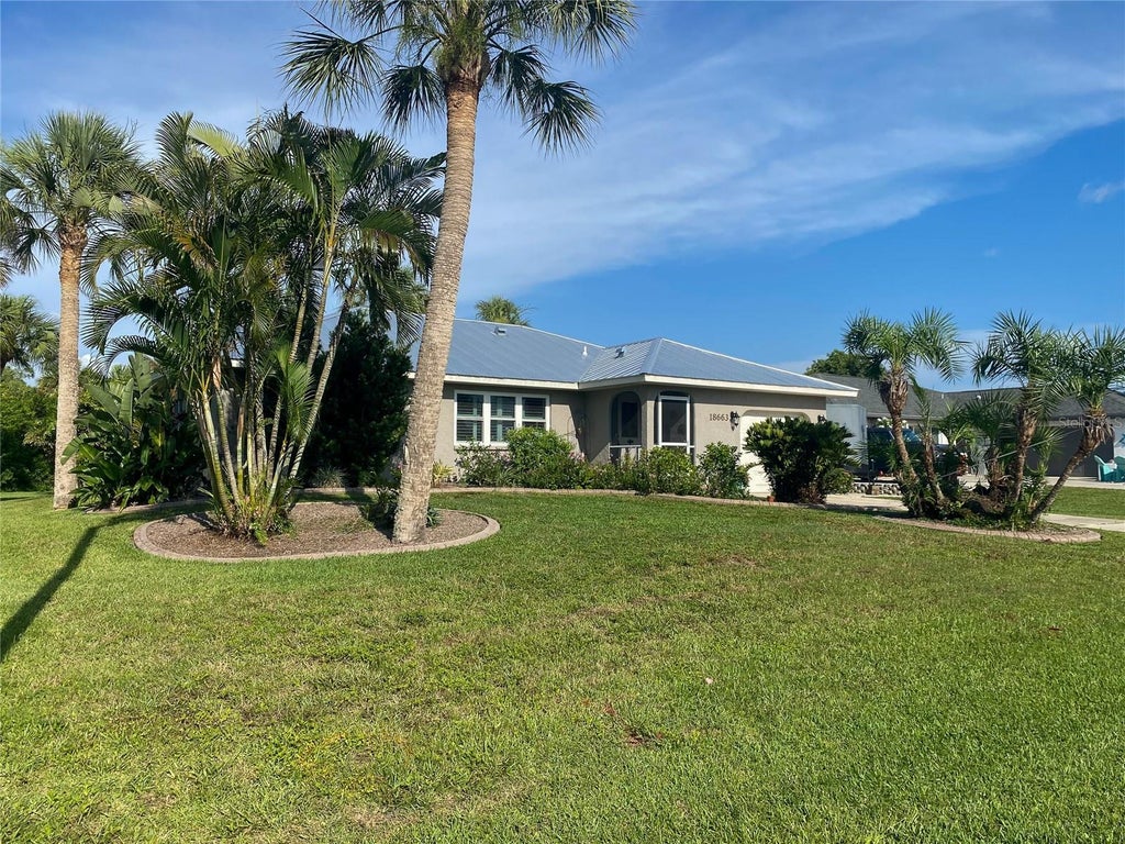 Photo of 18663 Macgill Avenue, Port Charlotte, FL 33948 (MLS # O6446406)