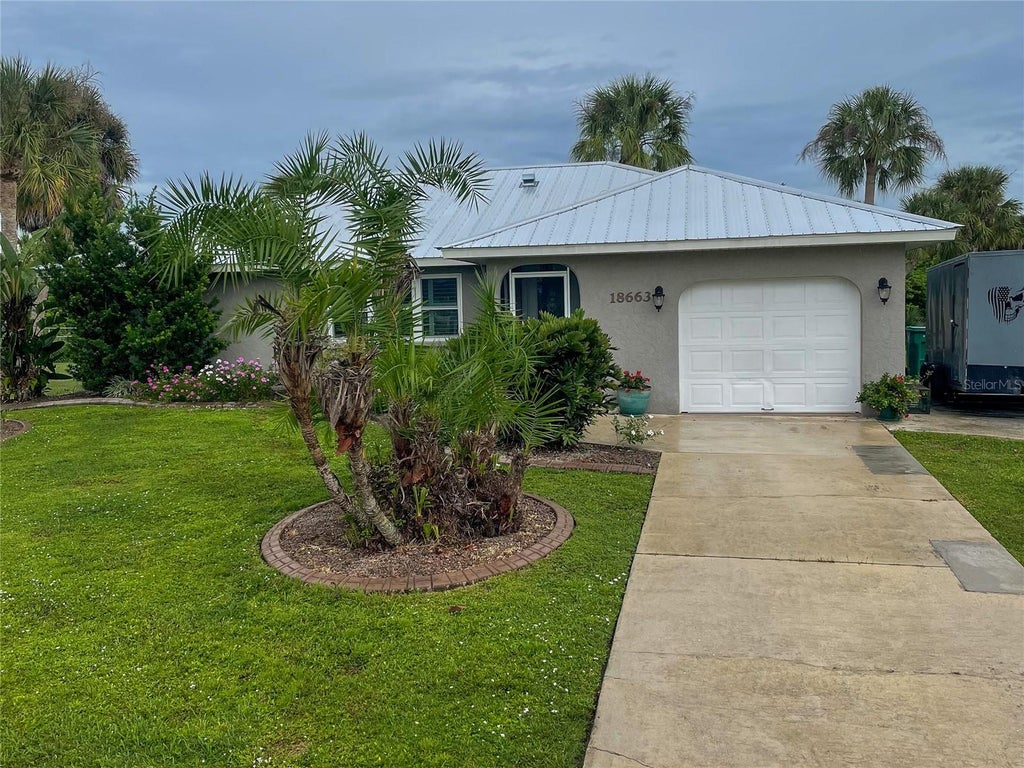 Photo of 18663 Macgill Avenue, Port Charlotte, FL 33948 (MLS # O6446406)