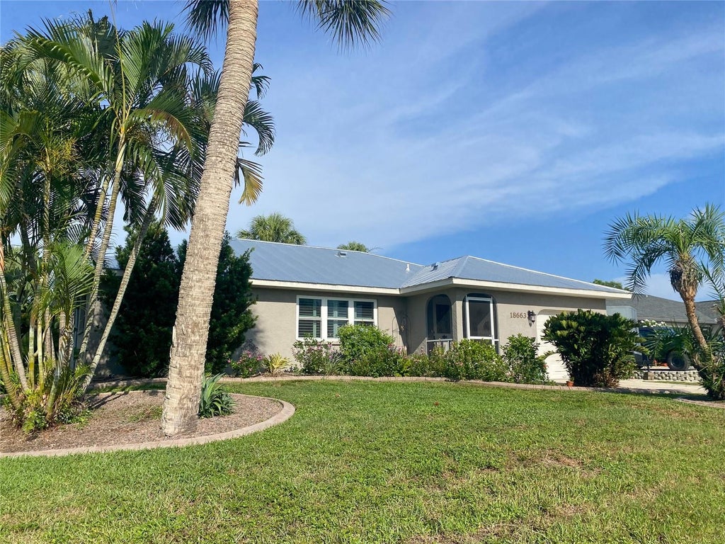 Photo of 18663 Macgill Avenue, Port Charlotte, FL 33948 (MLS # O6446406)