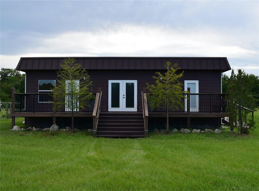 Looking for space in the country yet minutes to the city? This is it!! Located a mile and a half down the private dirt road off of State Road 44 and sitting on 32.6 acres is this 3 BR/1.5 BA modular home with unlimited possibilities. Enjoy morning coffee in your large kitchen overlooking the back yard. Sit on the front porch or take the 4 wheeler for an evening adventure. Relax in your large soaking tub with a glass of wine while watching your favorite show. Bring your horses, cows, ATV’s, RV. 17.6 acres are cleared and high and dry. Currently zoned A-1 with potential to be re-zoned. All within minutes to shopping and restaurants and only 15 minutes to the beach.