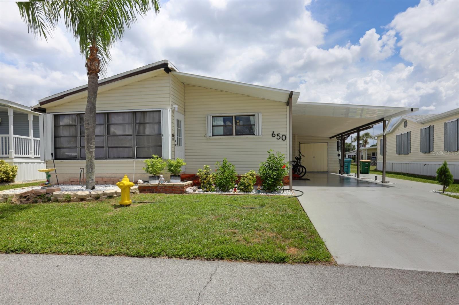 Step into modern comfort with this remodeled 1986 home situated on an interior lot within Maple Leaf Golf & Country Club. This home has been updated for style, function and peace of mind. Inside, you’ll find an inviting floor plan, light and bright interior with textured walls, new ceiling, LED lighting, upgraded luxury vinyl plank flooring and more. The kitchen shines with new cabinetry, sleek quartz countertops and stainless steel appliances. The bathrooms feature new fixtures and finishes. Laundry has been relocated into the home from the shed for added convenience featuring new upgraded front load washer and dryer. The front 168sq ft Lanai has many options, currently being used as a home office. On the exterior, the spacious 196sq ft storage shed could be ideal for a workshop. Driveway can easily accommodate more than one vehicle. You will enjoy seasonal or year-round comfort while also enjoying all that that Maple Leaf has to offer. New shingled roof March 2025 Perit#20250310333. Home is being sold partially furnished, no golf cart. ***Be sure to check out the two virtual tours links for a walk through video and 3-D virtual *** Maple Leaf is a resident owned 55+ community with an active resort lifestyle. Activities include award winning par 62, 18 hole golf course, 4 heated swimming pools, 5 tennis courts, bocce, lawn bowling, 2 shuffleboard court centers, 2 hot tubs, sauna, fitness center, woodworkers shop, pottery studio, 4 pickleball courts, two restaurants, full service bar, tiki hut with bar and over 75 clubs and activities. Price of home includes membership certificate.