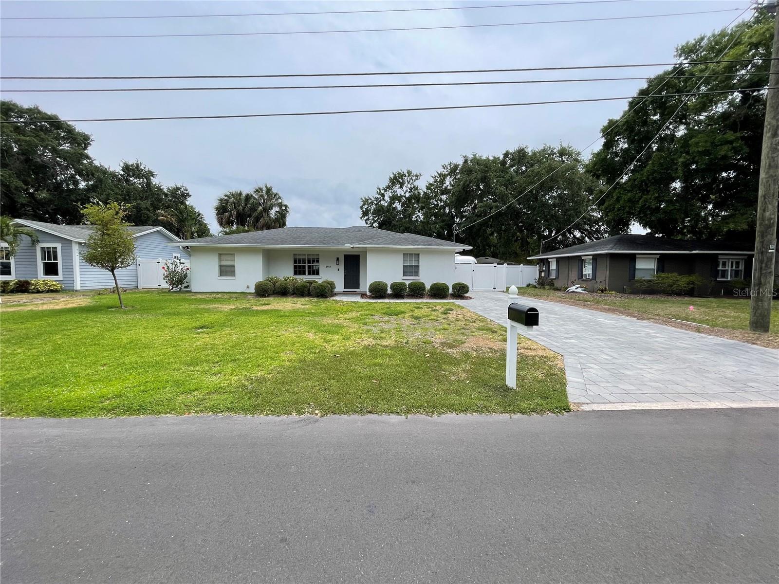 Welcome to this beautifully updated 3 bedroom, 2 bathroom home, perfectly positioned in the heart of South Tampa and zoned for the highly sought-after Mabry, Coleman, and Plant schools. Featuring a thoughtfully remodeled open-concept floor plan, the layout offers spacious rooms and a seamless flow throughout. The kitchen opens to the main living area with granite countertops, custom cabinetry with soft-close doors, and plenty of storage. Wood floors run throughout the living areas and bedrooms, adding warmth and style. The primary sweet is generously sized to fit a king bed and dressers, with a walk in closet complete with built in organizers and and an updated private bath. Both secondary bedrooms are spacious with closet organizers. A large utility room is conveniently located off the kitchen, providing extra space and functionality. Step outside to a backyard designed for entertaining, with a covered patio, low-maintenance turf lawn and shed with with electricity and AC. Just minutes from local dining, parks, shopping, and entertainment, this home combines comfort, convenience, and location making it a must!