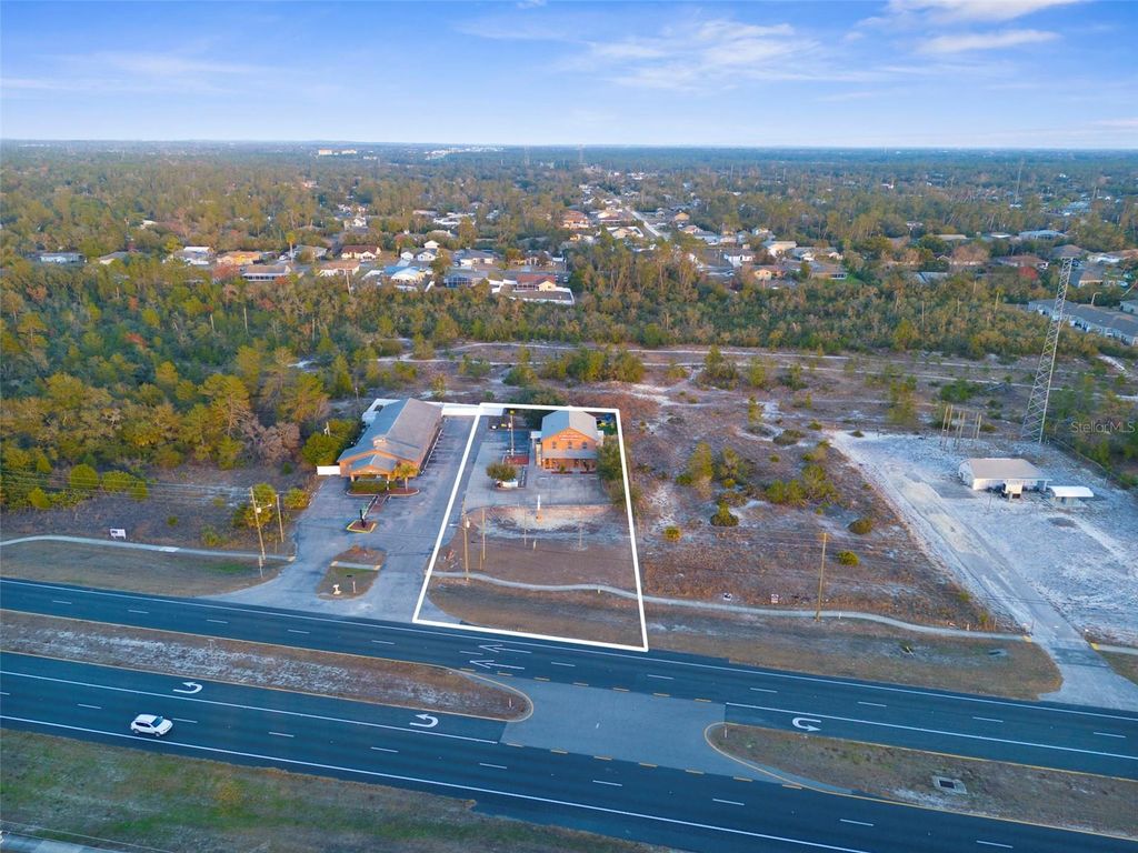 Photo of 7044 Commercial Way, Weeki Wachee, FL 34613 (MLS # W7872158)