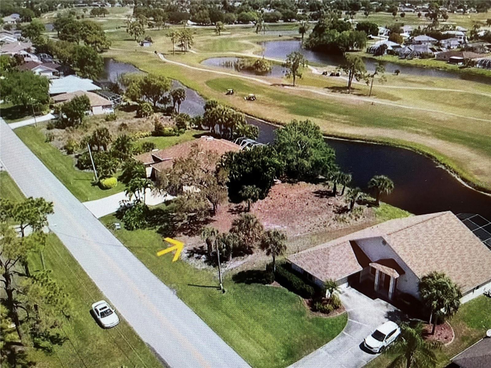 This is the only lot listed in Rotonda West that is both WATERFRONT and is on a GOLF COURSE. Enjoy spectacular, 180 degree panoramic views of both from the comfort of your own home. Imagine the incredible home and endless options this choice property affords you. For example, you could capitalize on these beautiful vistas using over-sized, zero-corner sliders and large picture windows overlooking the sparkling waters, lush green fairways, swaying palms, and winding golf course paths trailing off into the horizon. Picture an infinity pool that blends seamlessly into the waterfront and spilling over into the rolling green hills of grass. The pocketed, zero-corner sliders would completely disappear when opened. This creates a seamless flow between inside and out, as it allows the gentle subtropical breezes to waft through the interior, along with the sounds and fragrances of nature. All this creates an idyllic, resort-like ambiance. The mesmerizing views include a steady stream of jovial golfers in the distance, palm leaves rustling to the on-shore breezes, with osprey, eagles, and heron scooping up fish from the golf course lakes. At night, the full moon rises directly over the pond and fairways, illuminating the entire golf course with a surreal, soft glow. Enjoy these magic moments from a park bench under the mature oak tree draped with Spanish moss while enjoying the evening chorus of crickets, great-horned owls, and seasonal whippoorwills. Homeowners bordering the golf course enjoy an excellent relationship with the golf course. Homeowners have been given the option to draw free irrigation water from the ponds for a one-time hookup fee. That is why you see so many gorgeous yards with lush, healthy landscaping along golf courses. Another amenity that will save you time and money is the geographic location. It is just 1/3 mile from the western entrance to Rotonda West. When you live deep inside “the circle”, travel time and gas can add up quickly for those with active lifestyles. This location saves you both. And finally, here are 2 more very compelling reasons to build your dream home on this amazing lot. The obvious are the mesmerizing views and surrounding beauty that are there for your enjoyment all day, every day. Another reason is the increased appreciation and re-sale value this location imparts to your home when it is eventually sold. The premium you pay for this exceptional lot is likely to be returned to you several times over by value it adds to your home.