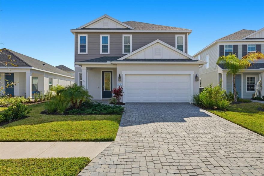 Welcome to this beautifully designed two-story home located in the highly desirable North River Ranch community of Parrish. Thoughtfully laid out for comfort and functionality, this spacious residence features a light and bright open-concept living area where the kitchen, dinette, and main living room flow seamlessly together. Large windows fill the space with natural light, creating an airy atmosphere ideal for both everyday living and entertaining. The kitchen offers generous counter space, modern cabinetry, a large island overlooking the living area, a walk-in pantry, and natural gas connections — a desirable feature for cooking and efficiency. A dedicated laundry room and convenient half bath are also located on the main floor. The primary suite is privately situated on the first floor and includes an en-suite bathroom with dual vanities, a spacious walk-in closet, and a comfortable retreat-style layout. Upstairs, you’ll find three additional bedrooms, a full bathroom, and a large loft space that provides flexibility for a second living area, home office, or media room. Step outside to enjoy the enclosed patio and fenced backyard, offering space to relax or entertain. Additional highlights include a two-car garage, extended driveway, and attractive front views overlooking water and mature trees that enhance the home’s curb appeal. Residents of North River Ranch enjoy a wide range of community amenities, including multiple resort-style pools, clubhouses, parks, playgrounds, trails, recreation spaces, and even a neighborhood skate park, all designed to support an active and connected lifestyle. Conveniently located near shopping, dining, and major commuting routes, this move-in ready home offers modern living in one of Parrish’s most sought-after master-planned communities.