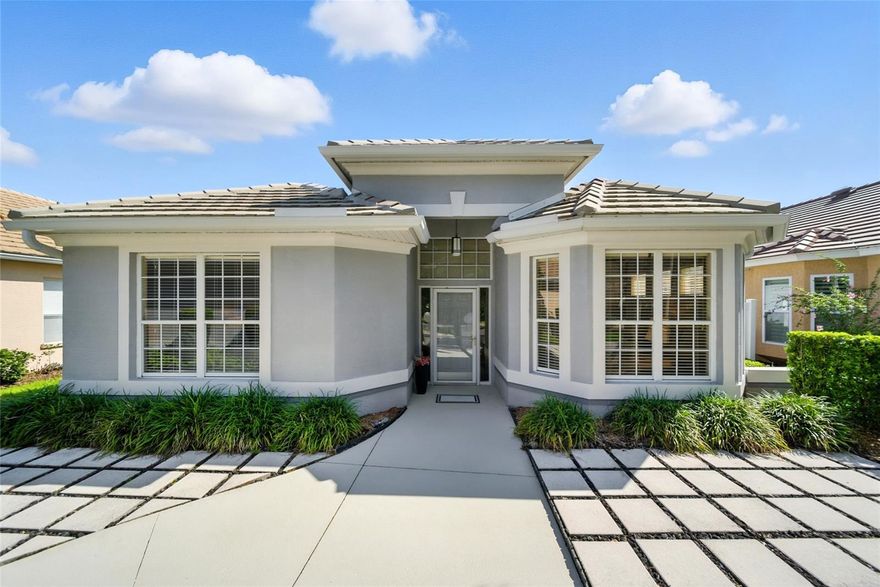 PRICE IMPROVEMENT! UNIVERSITY PARK. Immaculately maintained and move-in ready, this 2 bedroom, 2 bathroom home with a 2-car garage is a perfect blend of comfort and style. A long walkway welcomes you to the front entrance, surrounded by mature landscaping that sets a peaceful tone before you even step inside. Large windows flood the home with natural light, highlighting the spacious living area featuring a charming electric fireplace flat screen TV and sliding glass doors that open seamlessly to the expansive screened-in lanai. The lanai is ideal for enjoying morning coffee, reading a favorite book, or entertaining guests—all while taking in the serene conservation views. The round seating and center fireplace can stay! The kitchen flows beautifully from the living area and has been designed with both function and style in mind. A mosaic tile backsplash and sleek black granite countertops are perfectly balanced by warm, natural wood cabinets, creating a space that is both modern and inviting. The primary suite is generously sized, featuring a walk-in closet and a spa-like bathroom with a soaking tub and glass-enclosed shower. With private sliding glass door access to the lanai, you can step directly outside and enjoy the tranquility of your surroundings whenever you wish. When you are ready for a swim the neighborhood pool is just a few houses away. Located in the sought-after University Park neighborhood, this residence is more than just a home—it’s a vibrant lifestyle. Behind the secured, staffed entrance, you’ll find an award-winning community with 27 holes of four-star rated golf, 11 lighted Har-Tru tennis courts, pickleball, croquet, a fitness center, and first-class dining. The community also offers a wide variety of social clubs and activities, making it easy to connect with neighbors who share your interests. Minute from University Town Center Mall and just four miles from vibrant downtown Sarasota, you’ll have quick access to cultural attractions, museums, shopping, dining, and top-tier healthcare. And when you’re ready for the beach, you’re only a 15-minute drive to some of America’s most acclaimed beaches, as well as Nathan Benderson Park, the Ringling Museum, boating, and St. Armands Circle.This home offers the perfect opportunity to enjoy luxury living in a serene and private setting, while still being close to everything Sarasota and the beaches.