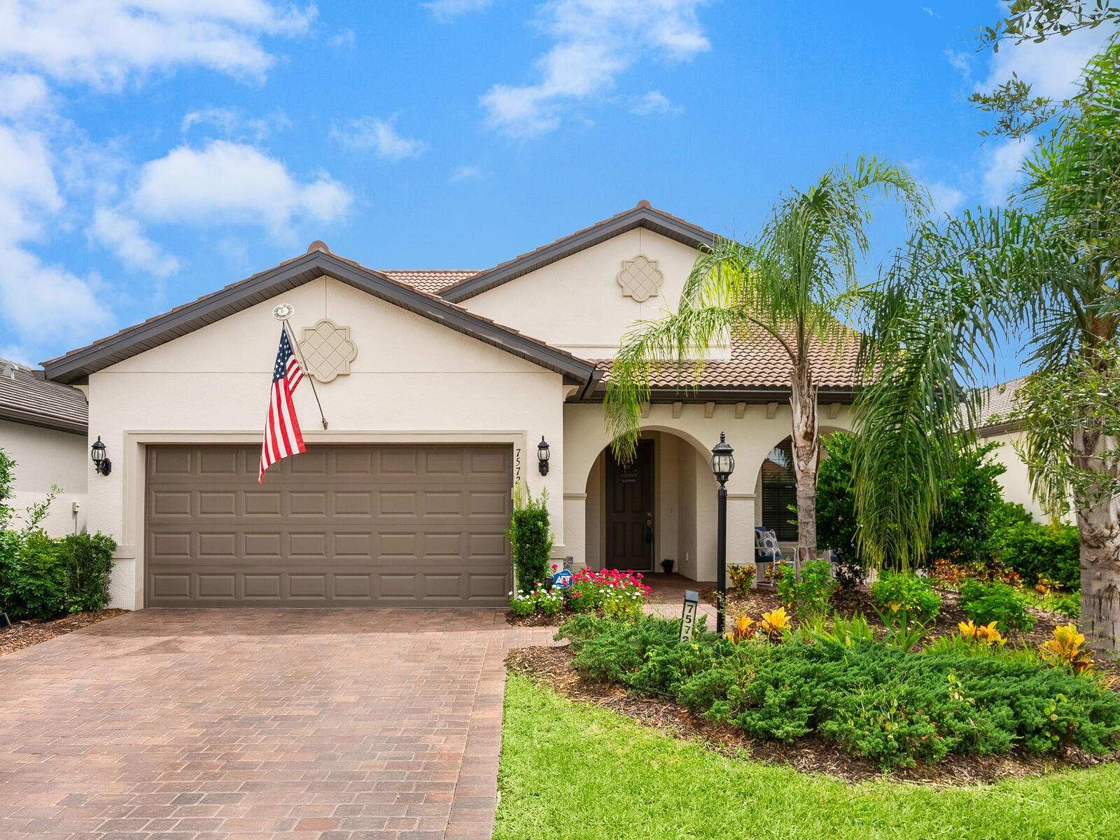 EXPERIENCE THE PINNACLE OF 55+ LIVING WITH OUR LATEST UPGRADES UNVEILED IN MAY 2025 AT THIS STUNNING HOME IN DEL WEBB AT LAKEWOOD RANCH! Recent enhancements include NEW LUXURY VINYL FLOORING THROUGHOUT THE FIRST FLOOR, FRESHLY PAINTED INTERIOR, NEW LIGHTING FIXTURES, NEWLY UPDATED KITCHEN CABINETRY, and NEW HURRICANE-IMPACT WINDOWS UPSTAIRS. For added peace of mind, the FIRST-FLOOR WINDOWS FEATURE ACCORDION-STYLE HURRICANE SHUTTERS for easy protection. The thoughtfully designed Martin Ray floor plan blends sophistication and functionality with a 3-car tandem garage, inviting front porch, and a versatile den or gathering room. A Butler’s Pantry with a KitchenAid wine refrigerator, wine rack, and glassware storage adds a touch of elegance. The kitchen is a chef’s dream, boasting granite countertops, soft-close cabinetry with roll-out drawers, under-cabinet lighting, a vented range hood, pendant lighting over the expansive island, a large walk-in pantry, and additional storage. The owner’s suite is a peaceful retreat with a tray ceiling, a spacious window for natural light, and a spa-like bath featuring a garden tub, frameless glass shower, and ceiling-height tile. The home is complemented by 8' solid core doors and upgraded baseboards. Upstairs, you'll find a generous loft space, an additional bedroom, and a full bathroom—ideal for guests or multigenerational living. Pocket sliding glass doors lead to a fenced backyard and a screened-in, paved lanai overlooking a private preserve, all on an oversized homesite. Grounds maintenance is included, allowing more time to enjoy the community’s 28,000-square-foot clubhouse, resort-style pool, fitness center, tennis and pickleball courts, art studio, billiards room, and more. Conveniently located near a resident-only gate, this home offers both privacy and easy access to the best of Lakewood Ranch. Don’t miss the opportunity to embrace a luxurious and low-maintenance lifestyle in this vibrant community.
