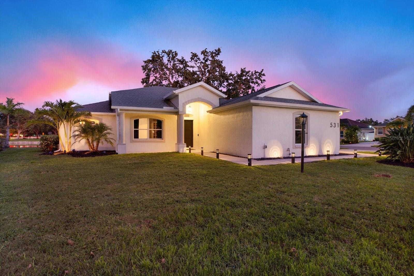 Wake up to panoramic views of tranquil lakes and the perfectly manicured 13th hole green-this stunning 3-bedroom, 2-bathroom home is a rare gem that blends luxury, function, and serenity on a spacious corner lot.
Nestled in a low cost HOA golf community, this home offers affordable access to the Florida golf lifestyle without compromising on design or privacy.
Completely and tastefully modernized inside and out, the residence showcases a clean, minimalist aesthetic with vaulted ceilings, an open-concept layout, and seamless indoor-outdoor flow. The thoughtfully designed kitchen and living areas are bathed in natural light, while the primary suite offers a calming retreat with stunning his and hers ensuite and walk-in closet.
Step outside to your fully reimagined outdoor oasis-an expansive, covered patio perfect for entertaining or relaxing, all while taking in uninterrupted lake and fairway vistas. The updated landscaping complements the sleek architecture, creating a cohesive modern ambiance.