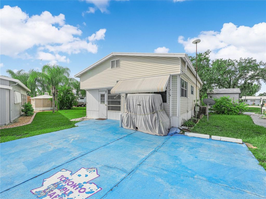 Photo of 21 Saddlebag Trail S, Lake Wales, FL 33898 (MLS # K4903046)