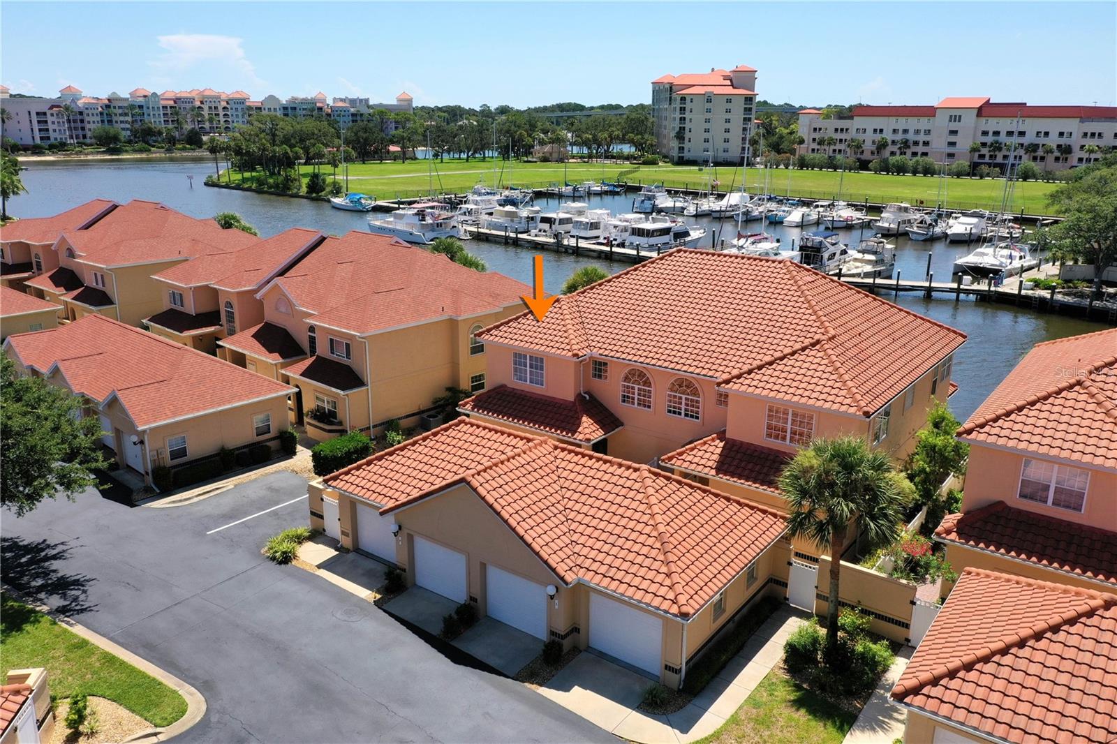 One or more photo(s) has been virtually staged. Discover 4 Marina Point Place a rare end-unit, waterfront townhouse in the coveted Marina Cove community, offering 2,223 sq ft of light-filled living space, 3 bedrooms plus a versatile flex room, and 2 full bathrooms and 1 half bath. From the moment you arrive, you’ll appreciate the gated paver walkway, private front courtyard, and oversized detached 2-car garage. The main level features a spacious primary suite with a walk-in closet and ensuite bath, a laundry/utility area, and an open concept living, dining, and kitchen designed to showcase the stunning water views. The upgraded kitchen boasts a built-in pantry wall with pull-out shelving and a generous layout perfect for cooking and entertaining all while looking out over the wide main saltwater canal with long views to the Intracoastal Waterway. Triple sliding glass doors lead to a covered, screened Lanai where you can relax to the sound of the water, or step out to the only private open-air waterfront patio in the community to sip your favorite drink and watch boats glide by. Upstairs, you’ll find two large guest bedrooms, a guest bath, and a spacious flex room, ideal as a home office, wellness space, or 4th bedroom. A large closet on the landing could be easily adapted for direct bedroom use. As an end unit, the home is bathed in natural light, with blinds that filter the sun beautifully. Marina Cove offers resort-style amenities, including a protected harbor with available boat slips for sale or rent, tennis/pickleball courts, putting green, community pool, clubhouse, and scenic walking paths to the ICW. Enjoy shaded park benches, a gazebo, and front-row seats to Cape Canaveral launches or the annual Palm Coast Holiday Boat Parade. Located in Marina Cove Landings, the newest phase with the community’s largest floor plans, this property offers the best of waterfront living, boating convenience, and a welcoming neighborhood. Enjoy Sunday Farmer’s Market and restaurants up the street at European Village. Come see it for yourself and make it yours—Welcome Home!