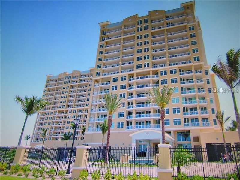 In this 2 bedroom/ 2 bathroom Waterfront condominium, you will be thoroughly enchanted by the picturesque marina view, enjoy a spacious balcony where you can watch the sunrise with a morning coffee and watch the sun sparkle off the waters and the beautiful boats in the 80 acre, deep water marina. In the evening the harbor lights up for you enjoyment at cocktail time. There is private elevator to your new home, 10' ceilings, 18" tile floors, granite countertops, secure gated community, lap pool, two additional pools, two spas, tennis, billiard room, office/conference room, movie theater room, guest suites, secured parking, split plan, ample storage, and a social room for parties. You will be close to the beaches, St Petersburg, Tampa and Sarasota