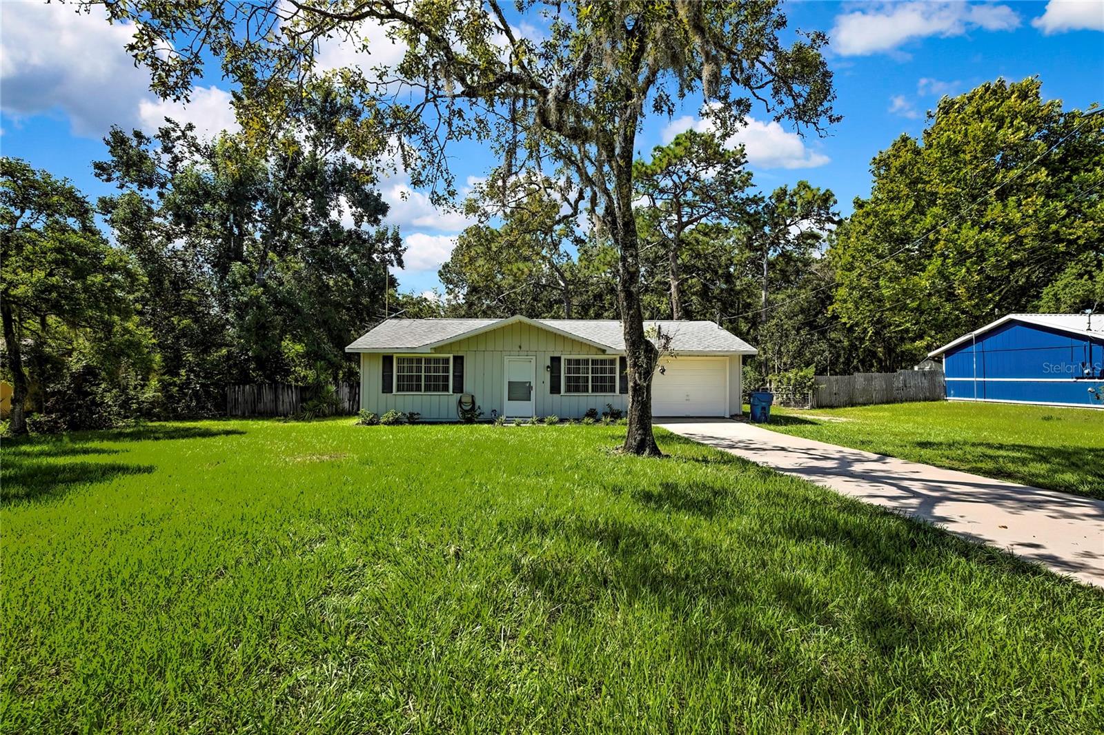 Charming Brooksville Home with Modern Updates & Room to BreatheLooking for the perfect blend of space, style, and small-town charm? Welcome to your new happy place in the heart of Brooksville! Sitting pretty on a generous 0.70-acre lot, this 2-bedroom, 2-bath home offers plenty of room to stretch out—inside and out.Step inside and you'll immediately notice the brand-new vinyl flooring that flows seamlessly through every room, giving the whole place a fresh, modern vibe (and no carpet drama to worry about). The kitchen is ready for your culinary adventures with gleaming new stainless steel appliances, while ceiling fans in every room keep you cool year-round.Natural light pours in from every angle, making the space feel bright and welcoming. Out back, you'll find a large screened-in patio—the ultimate hangout spot for morning coffee, evening wine, or late-night laughs without the mosquito guests. The fully fenced yard offers privacy, security, and a safe space for pets or kids to roam, and the backyard shed is ready for your tools, toys, or secret hobby hideout. Plus, the 1-car garage keeps your ride shaded and your storage in check.Zoned R1C, this property opens up a variety of possibilities while keeping that neighborhood charm intact.And let's talk location—Brooksville is a hidden gem! Spend weekends exploring the scenic hiking trails at Croom Wildlife Management Area, cooling off in the crystal-clear waters of Weeki Wachee Springs, or browsing the historic downtown with its cozy cafes and antique shops. Prefer to stay active? You're just a short drive from golf courses, bike trails, and some of the best nature spots Florida has to offer.Whether you're starting fresh, downsizing, or just ready for a change of scenery, this Brooksville beauty delivers comfort, convenience, and a whole lot of character.Come see it for yourself—you might just fall in love before you hit the driveway.