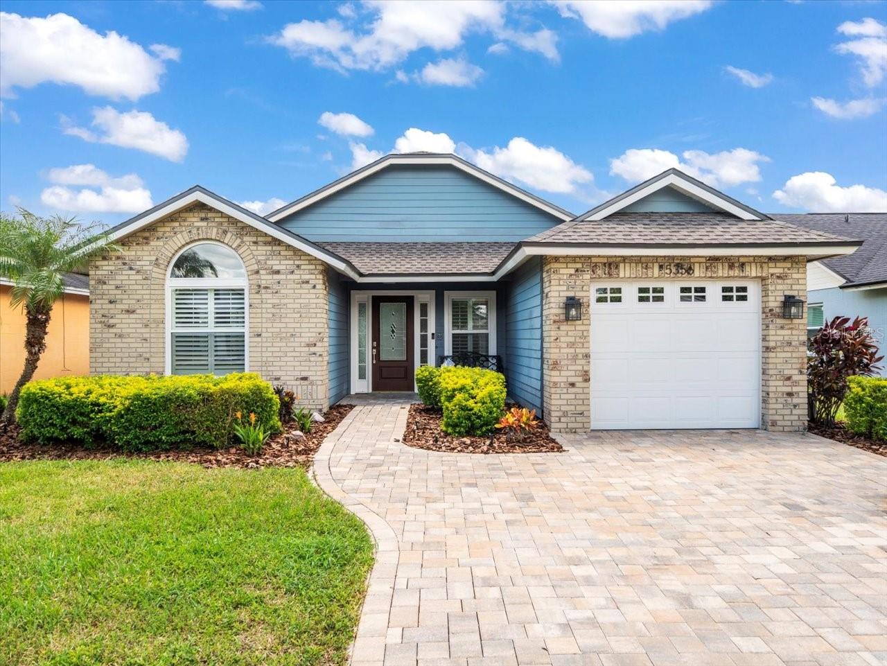Welcome to this delightful 3-bedroom, 2-bath home with a 1-car garage in the Hampton Park community. From the moment you arrive, you’ll appreciate the brick paver driveway and elegant entry leading into the formal living and dining rooms. The updated kitchen boasts stunning quartz countertops, abundant cabinetry, and a cozy eat-in space—perfect for casual meals. Additionally, the house has been updated with new windows, a new roof, a new impact sliding rear door, and sunburst shutters. Two comfortable guest bedrooms are tucked off the kitchen, sharing a full bath with a shower/tub combo. The spacious family room features vaulted ceilings and sliding glass doors that open to the lanai and backyard, creating a wonderful space for indoor-outdoor living. The private primary suite is located at the rear of the home and offers a large closet, vaulted ceiling, and an en-suite bath with dual sinks and a walk-in shower. Outside, the fenced backyard includes a brick paver patio, ideal for relaxing or entertaining. Move-in ready and perfectly located near shopping, dining, and major highways—this home offers comfort, style, and convenience!