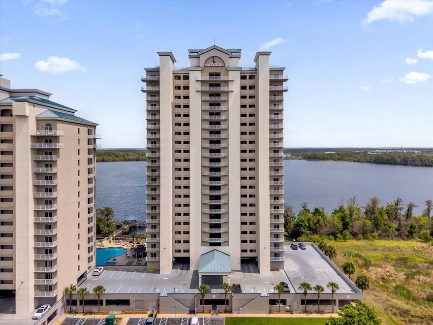 Welcome to your dream retreat in the sky—an exceptional 4th-floor condo in the highly sought-after Blue Heron Beach Resort, offering breathtaking panoramic views of Lake Bryan, in pristine condition and also rarely used by the owner. This fully furnished 1-bedroom residence delivers the feel of a penthouse with the ease of a turnkey vacation home. The kitchen has stainless steel appliances, that have been rarely used. Soaring ceilings and an expansive 147 sq ft private balcony create a bright, open living space—perfect for enjoying stunning sunrises, sunsets, and even nightly Disney fireworks. The unit’s corner location provides added privacy with a semi-private entrance and abundant natural light throughout. Ideally located just minutes from Walt Disney World, this property is a proven Airbnb/short-term rental favorite, offering strong income potential with the flexibility to self-manage via Airbnb, VRBO, or a property management company. Blue Heron Beach Resort offers outstanding amenities including two heated swimming pools, jacuzzi, fitness center, scenic boardwalk, fishing pier, gazebo, lake access with private dock, dog park area, and 24-hour front desk service. A poolside bar/refreshment area enhances the resort-style experience. This unit comes fully furnished, including most furniture, dishes, cookware, utensils, linens, towels, and electronics. Recent updates include two modern ceiling fans, washer and dryer, newer furniture pieces, two newer mattresses, and a newer bed. Tower 2 is known for its superior construction, quieter environment, and more desirable setting, along with lower taxes and maintenance costs. HOA/maintenance includes internet, cable TV, water, local phone service, and exterior maintenance. Enjoy a true “million-dollar view” with unbeatable proximity to Disney, shopping, dining, and all of Orlando’s top attractions. Whether you're looking for a vacation home, investment property, or both, this condo checks all the boxes.