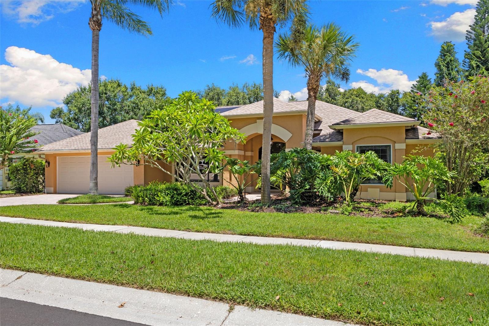 Cobbs Landing Beauty! Located on a quiet street in the desirable Cobb's Landing community, this 4-bedroom, 2-bath, heated saltwater pool home offers a private setting and a smart, functional layout. The screened two-level lanai, paver patio, and solar-heated pool make the outdoor space perfect for entertaining or everyday enjoyment. Step inside through a custom Brazilian oak leaded-glass door into a light-filled formal living and dining area with cathedral ceilings and tile flooring throughout. The kitchen features granite countertops, maple cabinetry, stainless appliances, tile backsplash, and a center island, all opening to a spacious family room with skylights, a wood-burning stone fireplace, and a butlers pantry. The split-bedroom floor plan includes a generous master suite with direct pool access, high ceilings, walk-in closets, and a renovated bath with dual vanities, a garden tub, walk-in shower, and private water closet. Three additional bedrooms are located in their own wing, along with an updated full bath that also serves as a pool bath. This home is equipped with a fully owned solar panel system and a 3-bank 45 kW battery backup, offering long-term savings and peace of mind during power outages. Additional features include: Reclaimed water irrigation, 2-car garage, Rain Gutters with Gutter Guards, Pool Heater 2023, EV Charging Outlet, Roof 2023, Solar Panels and Battery Back Up System 2023. Zoned for Palm Harbor University High School Enjoy community tennis courts, playground, basketball court, and marina with access to Lake Tarpon. HOA includes trash and recycling services. This home is move-in ready. Schedule your showing today!