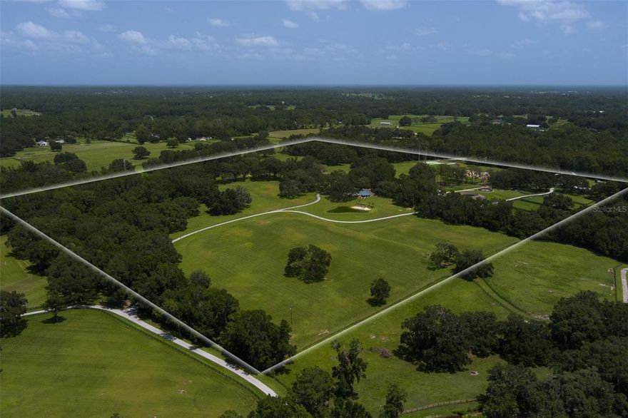 This beautifully maintained 70 acre farm, located deep in the heart of NW Ocala's horse country, has it all!  Great location?  You bet it is.  It's 15 minutes or less to shopping, dining, and the World Equestrian Center, the foremost equestrian venue in the country!  This high and dry farm is board fenced, loaded with lush green grass and majestic granddaddy oaks.  The custom 2BR/2BA home features tons of full wall windows for views in every direction, field stone accents, cathedral ceilings, fireplace, and so much more.  It has been recently upgraded with new features and fixtures, giving the entire home, especially the kitchen and baths, a whole new feel. The secondary 3 BR/2BA guest home has undergone a full makeover as well, bringing it to contemporary and modern tastes and standards.  But it doesn't stop there.  This farm also includes a CB 15-stall barn with full bath, storage, and kitchen/lounge/office.   A "pole barn" features 4 wash racks with hot/cold water, and an enclosed a/c tack/laundry/storage room.  There is an additional 4 bay pole barn for equipment and tool storage, plus a Eurosizer, and professional arena with covered viewing stand.  This gorgeous one-of-a-kind farm is an opportunity that doesn't happen often; you don't want to miss it.