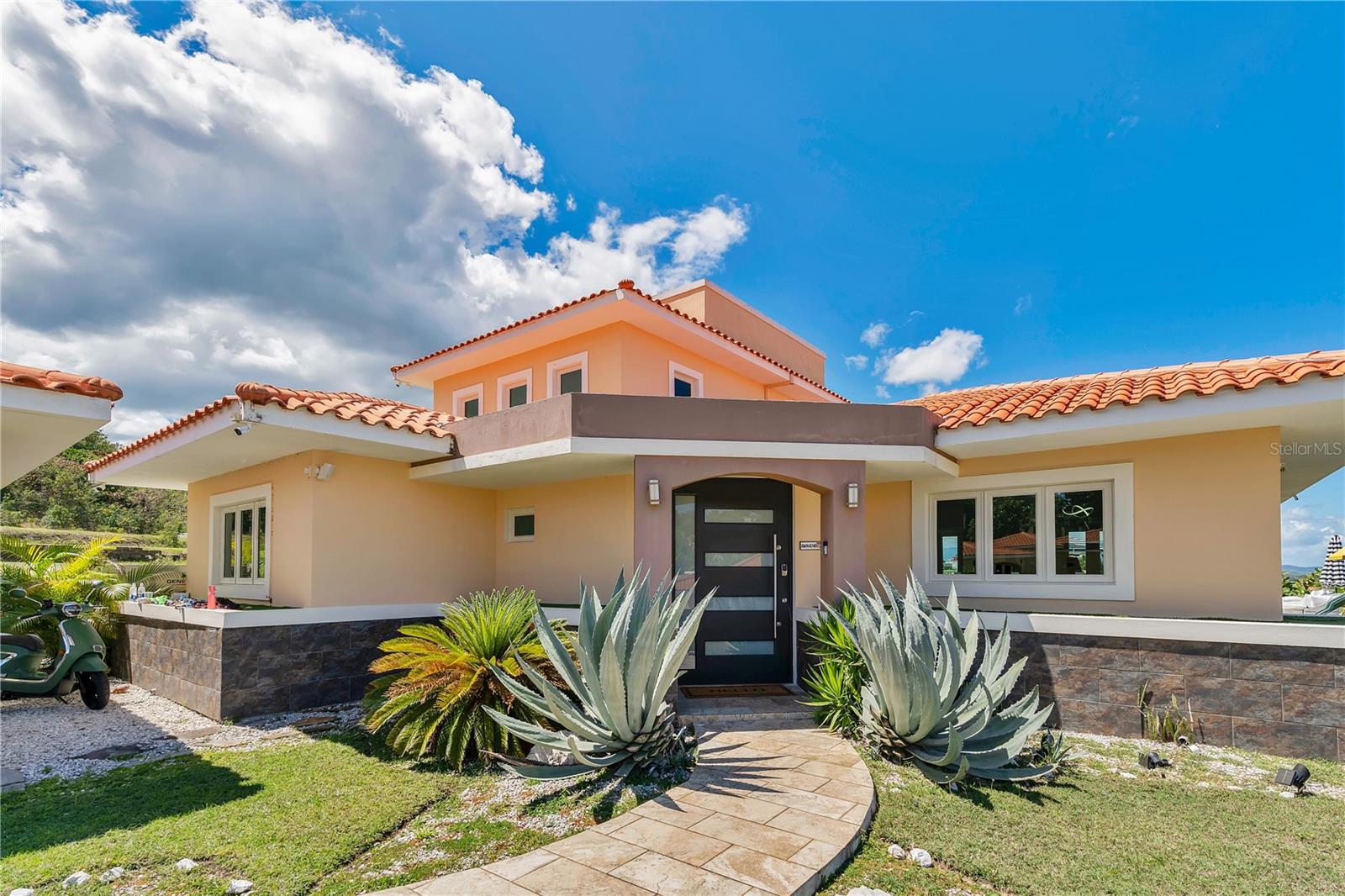 Elegant Retreat at The Views, Palmas del Mar – Humacao, Puerto Rico
Discover serene Caribbean living in this stunning 2-story home at The Views, Palmas del Mar. Perfect for families, couples, or nomadic workers seeking a peaceful space to live, work, and retreat, this residence offers spectacular views of the Caribbean Sea and an open, inviting layout.
With 4 bedrooms, 3.5 baths, and generous storage throughout, the spacious design flows seamlessly from the main living areas to the backyard and pool terrace — ideal for hosting gatherings or simply unwinding in your private oasis.
Palmas del Mar offers an exceptional lifestyle, featuring a private bilingual school, a lively farmers market,
a Casino Hotel with world-class facilities, a Marina for boat enthusiasts, a variety of excellent restaurants,
and a top-notch golf course for lovers of the sport.
All this, just a short drive from the vibrant cities of San Juan, Caguas, and Fajardo,
blending the best of quiet retreat and convenient access to urban energy.
Live, work, and relax surrounded by beauty, community, and comfort.