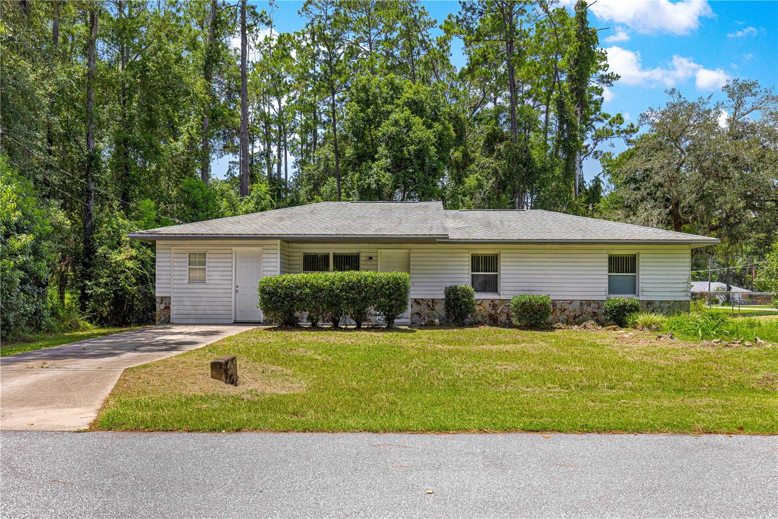 Best priced home in SSS, this 3-bedroom, 1-bath home sits on a fully fenced corner lot just steps from the Greenway trailheads. Whether you're biking, hiking, or just enjoying the outdoors, adventure is right outside your door. Inside, you’ve got everything you need with a practical layout, No carpet, updated A/C in 2024, and a roof from 2013. Less than 3 minutes to Publix and Walmart, and just 15 minutes to downtown Ocala. Great location, great value.