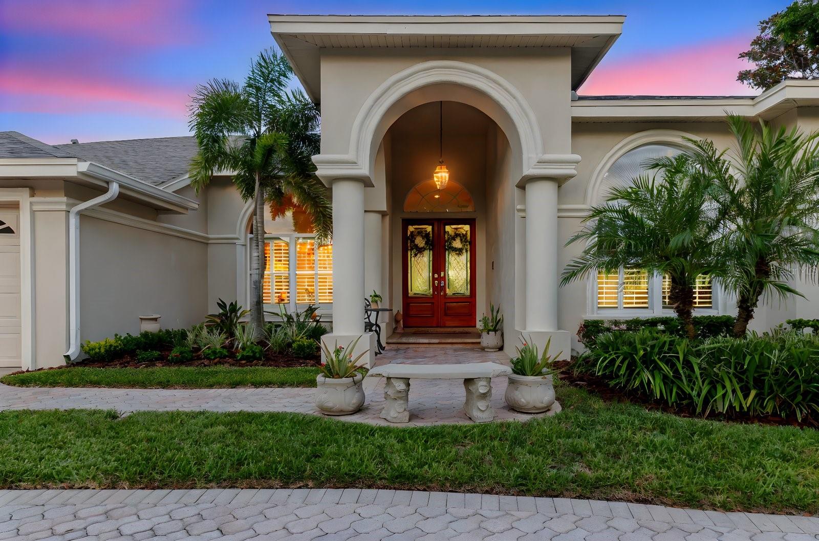 Exquisite luxury awaits in this stunning approximately 4,000 sq ft pool home, nestled on a premium 0.5+ acre lot in the exclusive, gated President’s Landing of Lansbrook. Surrounded by lush tropical landscaping, this residence backs to a serene pond and conservation area, offering unparalleled privacy with no rear neighbors.
Enter through double leaded glass doors into a grand foyer, where soaring ceilings, crown molding, and abundant natural light create an inviting ambiance. The formal dining and living rooms exude elegance, while the updated primary suite boasts a spa-inspired ensuite with quartz countertops, rain glass panels, dual sinks, and a custom dream closet with ornate chandelier, built-in ladder, and hidden storage. An adjoining office adds functionality.
The gourmet kitchen features stainless steel appliances, a center island, breakfast bar, and cozy nook. The family room, with a wood-burning fireplace, 16’ ceilings, an 84” ceiling fan, and a wall of sliders, seamlessly connects to the tropical pool oasis. Enjoy a brick paver deck, solar-heated pool, fountain waterfall, and outdoor kitchen with grill, awning, and curtains—perfect for entertaining with power for an outdoor TV.
Three oversized bedrooms, each with adjoining bathrooms, provide ample space. The fourth bedroom, ideal as an in-law suite, includes a bonus room with a bay window overlooking the pool and pond, plus access to a fenced brick paver courtyard. Additional highlights include a Whirlpool washer/dryer on pedestals, abundant storage, and meticulous maintenance.
Roof (2025). Daikin A/C (2024) highly efficient, lower a/c bills, super quiet.
Hybrid Hot Water Heater (2024) 80 gallons extremely efficient, Water Softener (2025), garage door opener (2024), exterior recently painted. Microwave (2024). Terminix termite baiting system maintained, and RO water filter. . Just passed a 4 pt inspection. Seller offering a Home warranty. Charging station and refrigerator in the garage does not convey. President's Landing has a private park, boat ramp and boat slips that can be leased at a very low price which is exclusively for President's Landing Residents. You can also enjoy all the amenities that Lansbrook offers, this development is on 2500 acre LaKe Tarpon. Lansbrook also has a boat ramp and day docks you can use as well. There are multiple parks, roughly 5 miles of shaded tree lined sidewalks, playgrounds, basketball courts, soccer fields, and pickleball! Top Rated Schools, a very popular YMCA and Golf Course nearby. 20 minutes to the beach, 25 min to Tampa International Airport, 25 min to Downtown St. Pete. No Flood or wind damaage from previous hurricanes.
Move-in ready, this home offers luxury, privacy, and resort-style living in a premier community. Don’t miss this rare gem—schedule your private tour today!