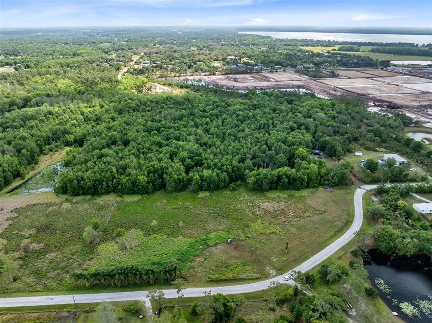 Owner Financing available! Approximately +/-8.07 Acres of vacant land in the desirable and fast-growing St. Cloud Manor Estates—with NO HOA, NO CDD! This offering includes three parcels (PID# 112730495000010010, 112730495000010175, & 122730495000010090), providing ample space for your vision. With approximately 717 feet of frontage, this property presents endless possibilities for those seeking space, privacy, and future potential.
The land is zoned AC (Agricultural Development and Conservation), and future land use is designated as Mixed Use. Buyers are encouraged to verify all zoning, land use, and lot dimensions with Osceola County. Part of the property may require rezoning for development. Property lines shown in images are estimated and not guaranteed.
This property offers a peaceful setting with room for outdoor activities, gardening, recreational vehicles, or agricultural use, all while being within close proximity to key areas including Lake Nona, Medical City, Orlando International Airport, major highways, and the Florida Turnpike. East Coast beaches and major Central Florida attractions are also just a short drive away.
Located in an area experiencing ongoing growth and development, this land is ideal for those looking to invest for the future.