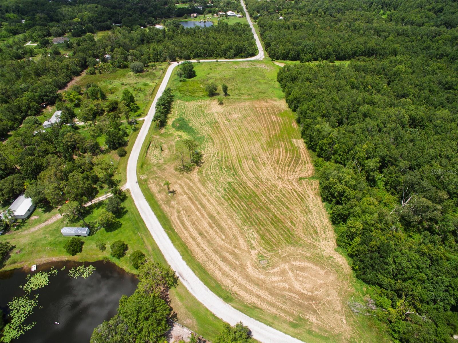 Discover a unique opportunity to own approximately +/-8.07 Acres of vacant land in the desirable and fast-growing St. Cloud Manor Estates—with NO HOA, NO CDD! This offering includes three parcels (PID# 112730495000010010, 112730495000010175, & 122730495000010090), providing ample space for your vision. With approximately 717 feet of frontage, this property presents endless possibilities for those seeking space, privacy, and future potential.
The land is zoned AC (Agricultural Development and Conservation), and future land use is designated as Mixed Use. Buyers are encouraged to verify all zoning, land use, and lot dimensions with Osceola County. Part of the property may require rezoning for development. Property lines shown in images are estimated and not guaranteed.
This property offers a peaceful setting with room for outdoor activities, gardening, recreational vehicles, or agricultural use, all while being within close proximity to key areas including Lake Nona, Medical City, Orlando International Airport, major highways, and the Florida Turnpike. East Coast beaches and major Central Florida attractions are also just a short drive away.
Located in an area experiencing ongoing growth and development, this land is ideal for those looking to build a custom home or invest for the future.