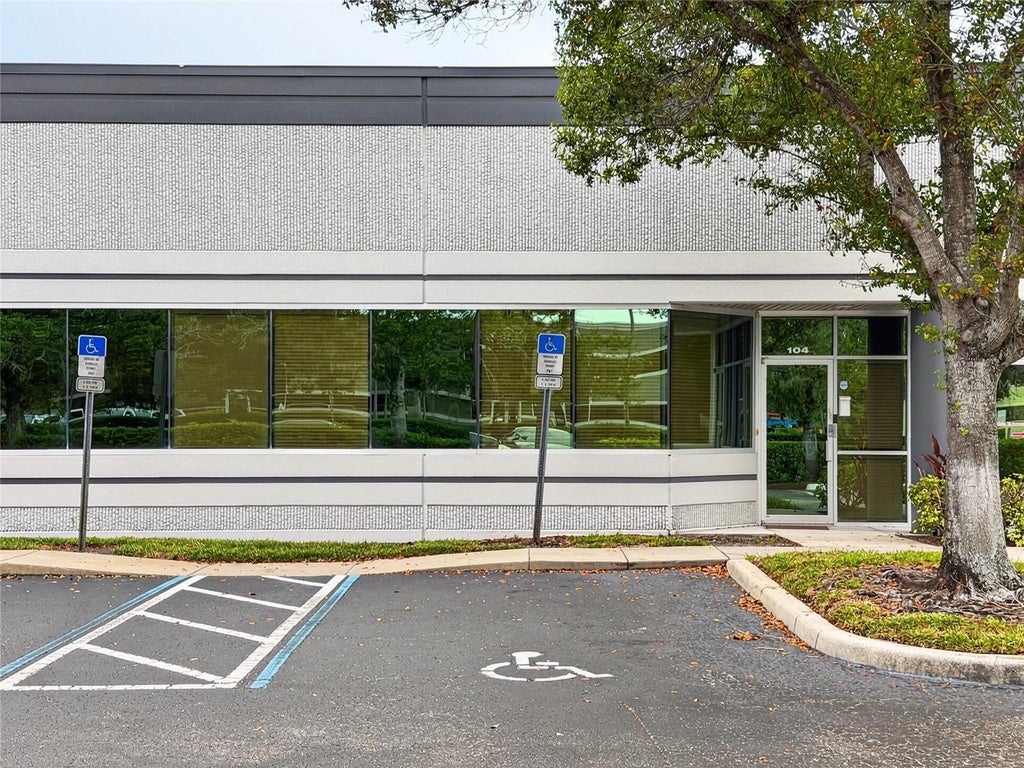 Photo of 7751 Kingspointe Parkway #104, Orlando, FL 32819 (MLS # O6448564)